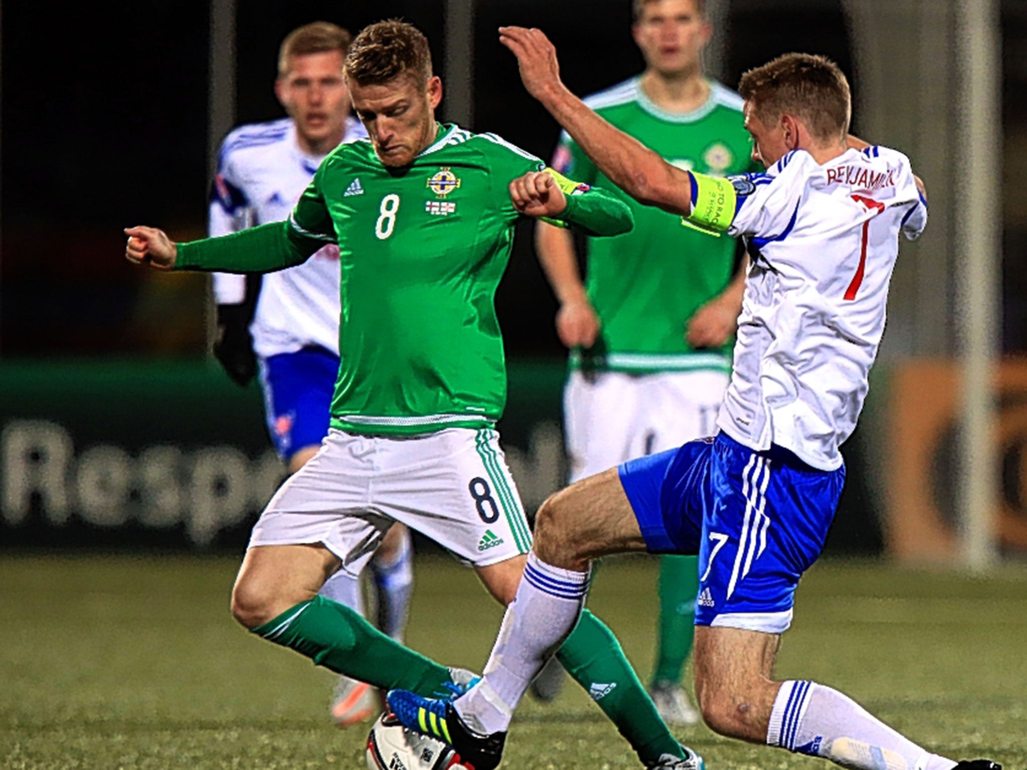 Steven Davis (left) in action for Northern Ireland in the 3-1 win over the Faroe Islands in Torshavn on Friday