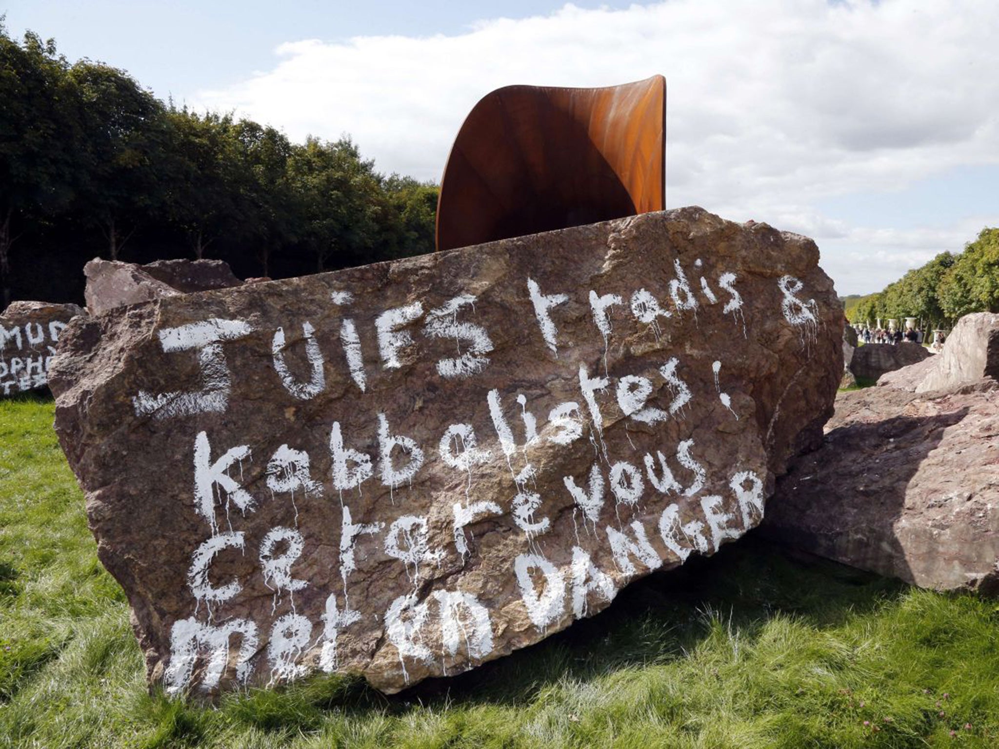 Anti-Semitic inscriptions written with white paint daubed onto Anish Kapoor's 'Dirty Corner'