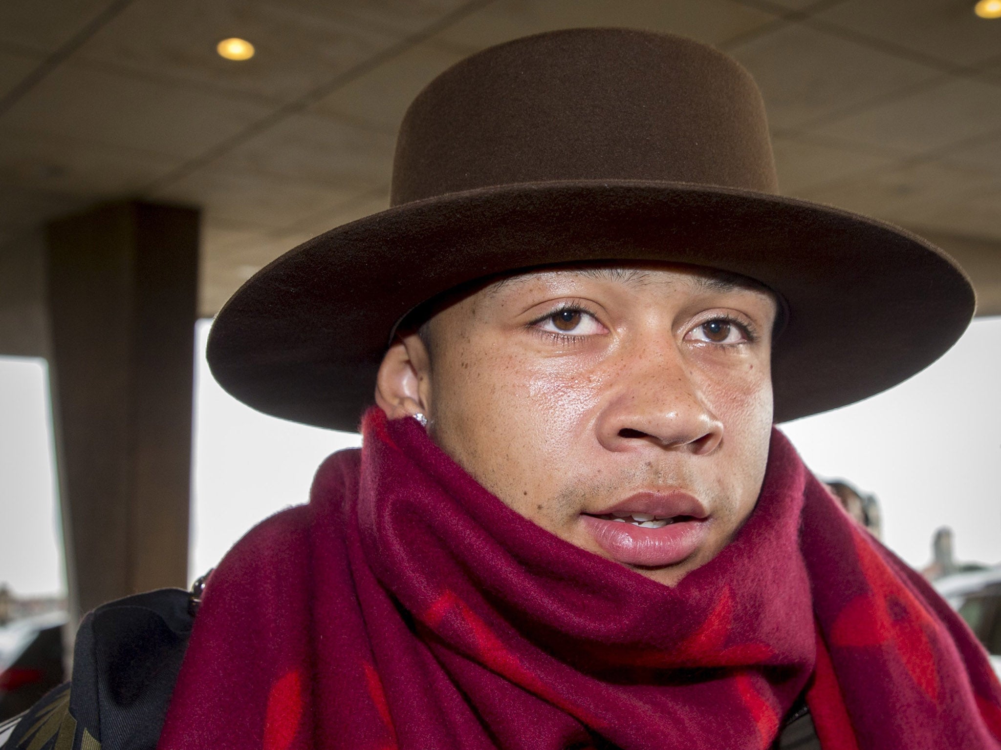 Memphis Depay arrives at the Dutch training camp in his hat and scarf