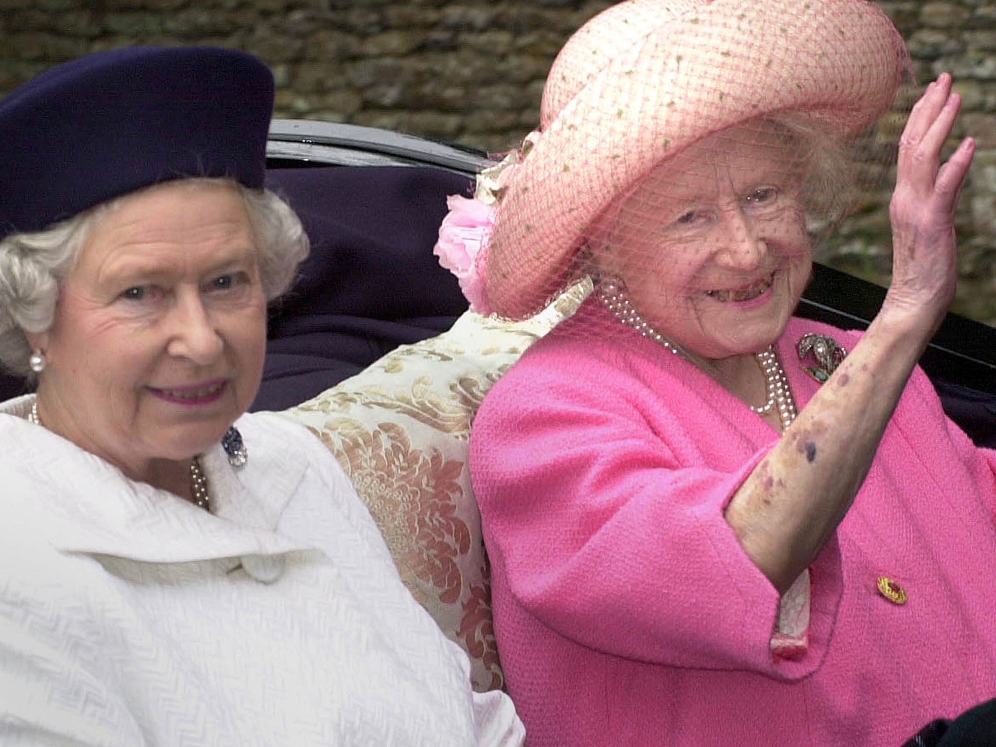 Queen Elizabeth II and the Queen Mother leaving church by horse drawn carriage on the Sandringham Estate in Norfolk, 2000