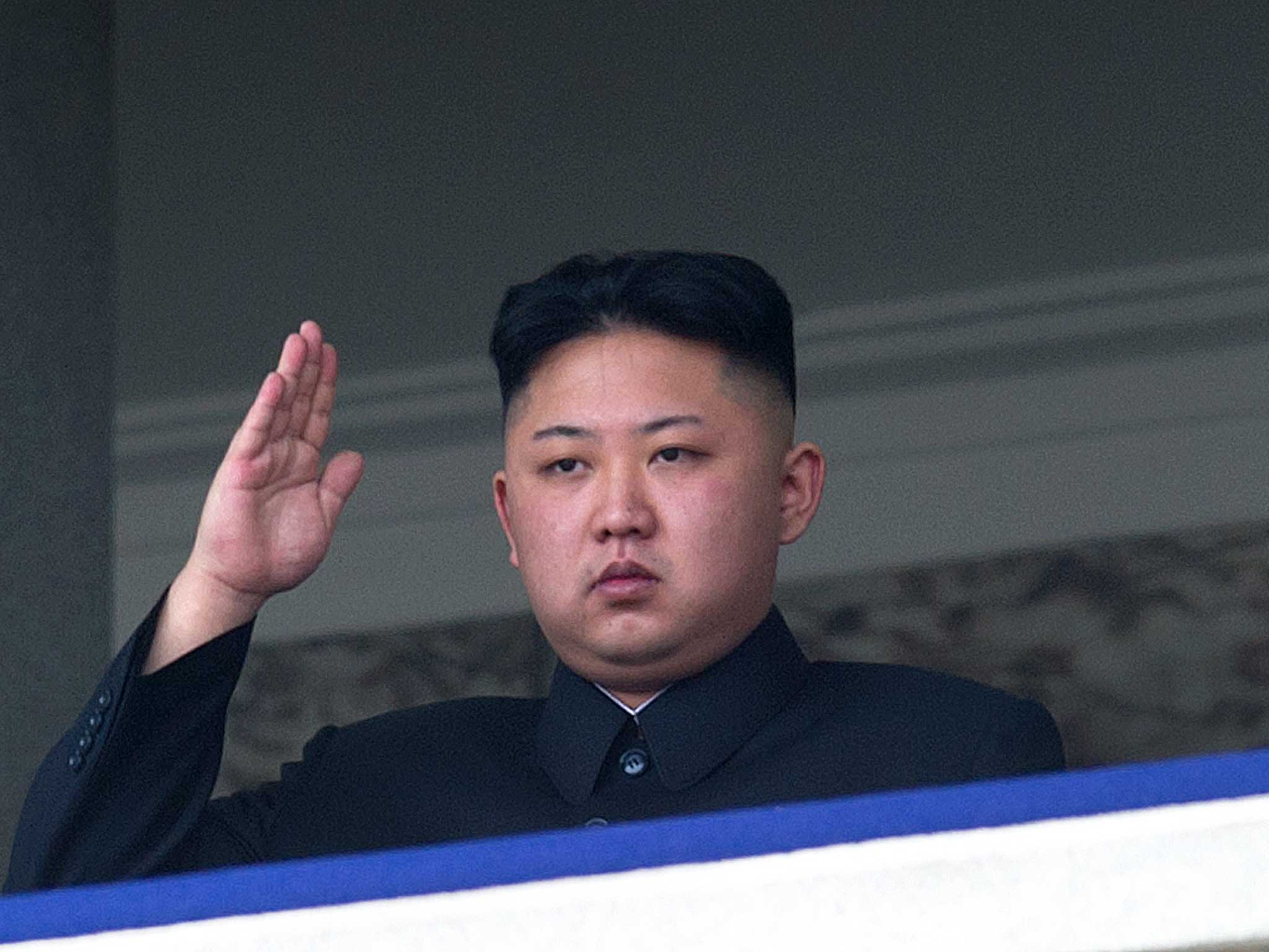 Jong-un salutes a parade in 2012