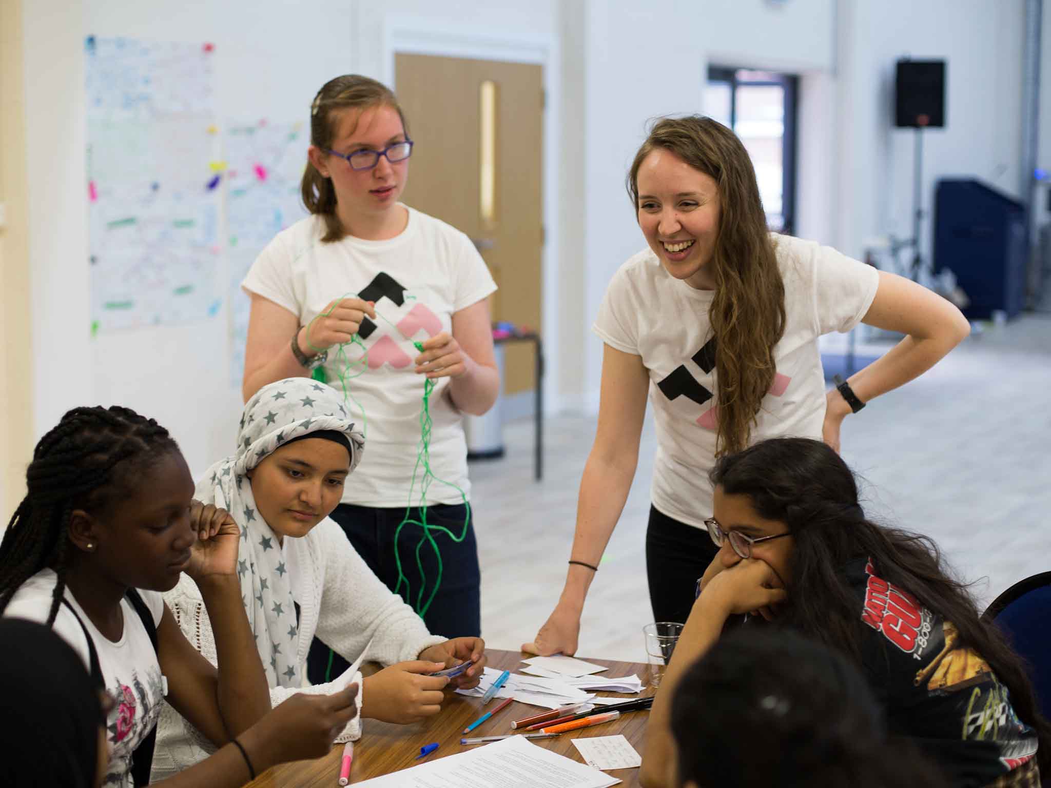 Jessy McCabe (left, standing) with Fearless Futures CEO Hanna McCloskey (right)