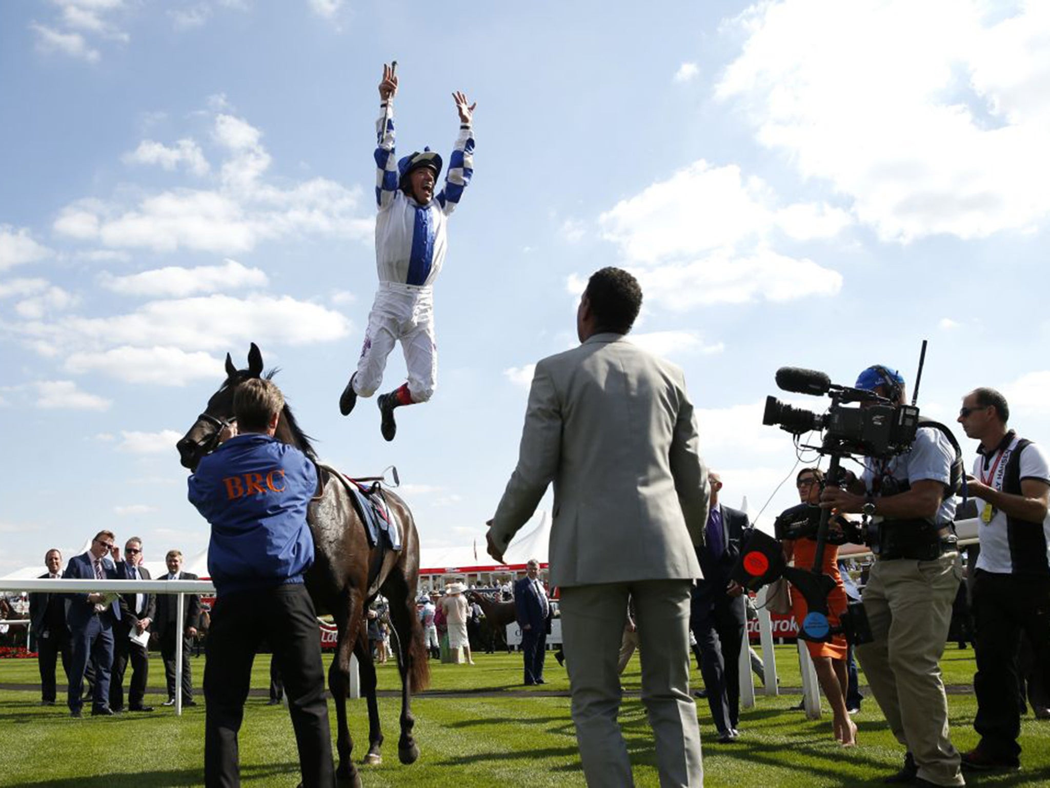 Frankie Dettori performs a flying dismount after winning on Nemoralia at Doncaster