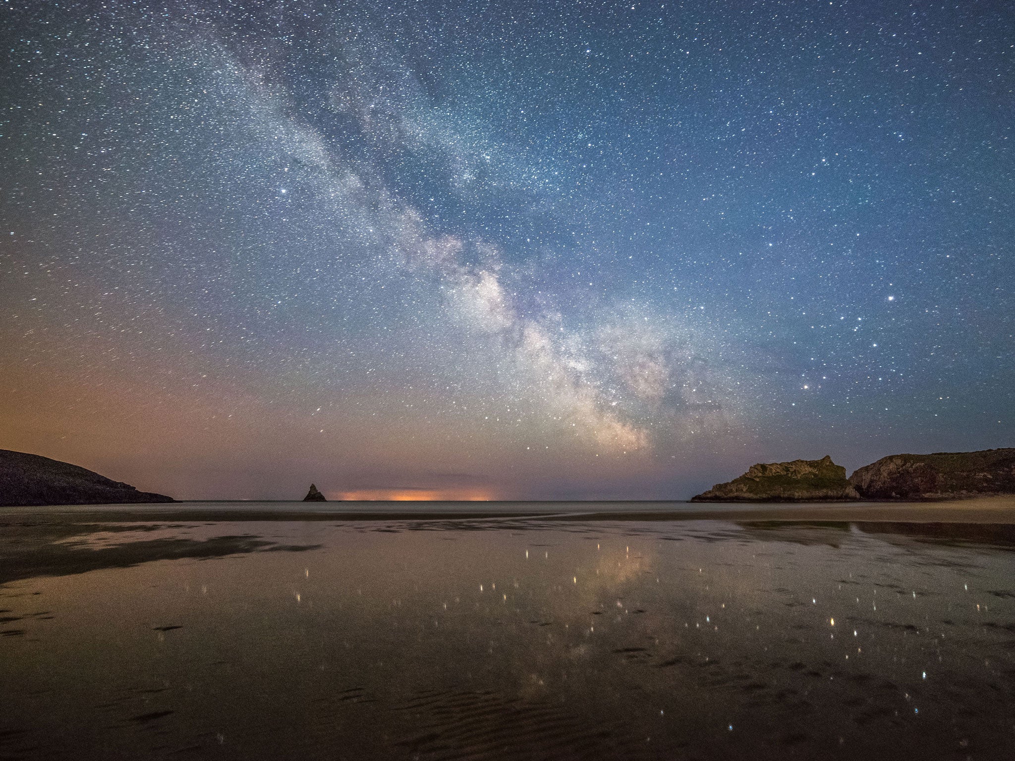 The Milky Way streaking across the sky above Broad Haven beach in Pembrokeshire (Rex)