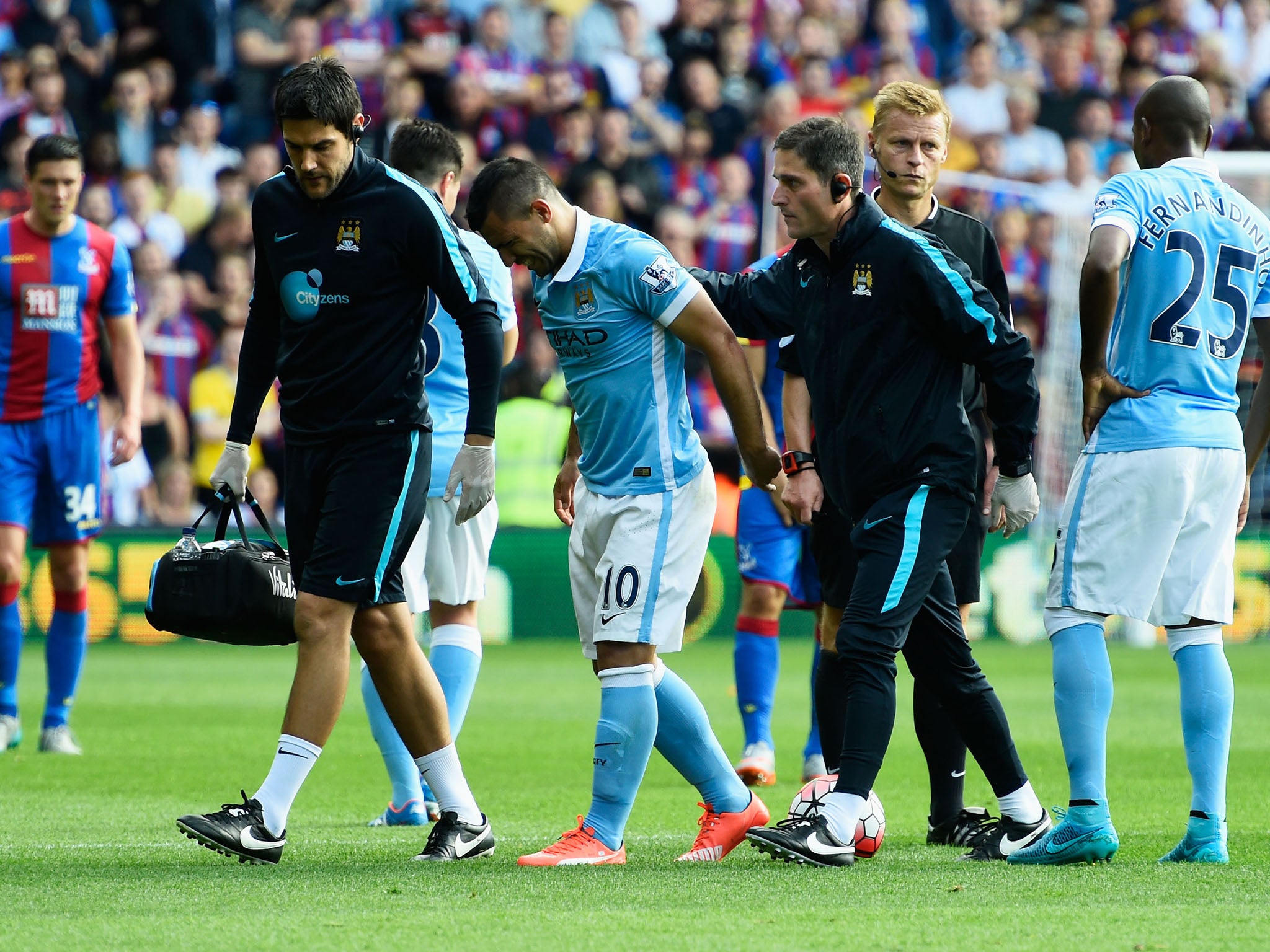 Sergio Aguero limps off the field at Selhurst Park