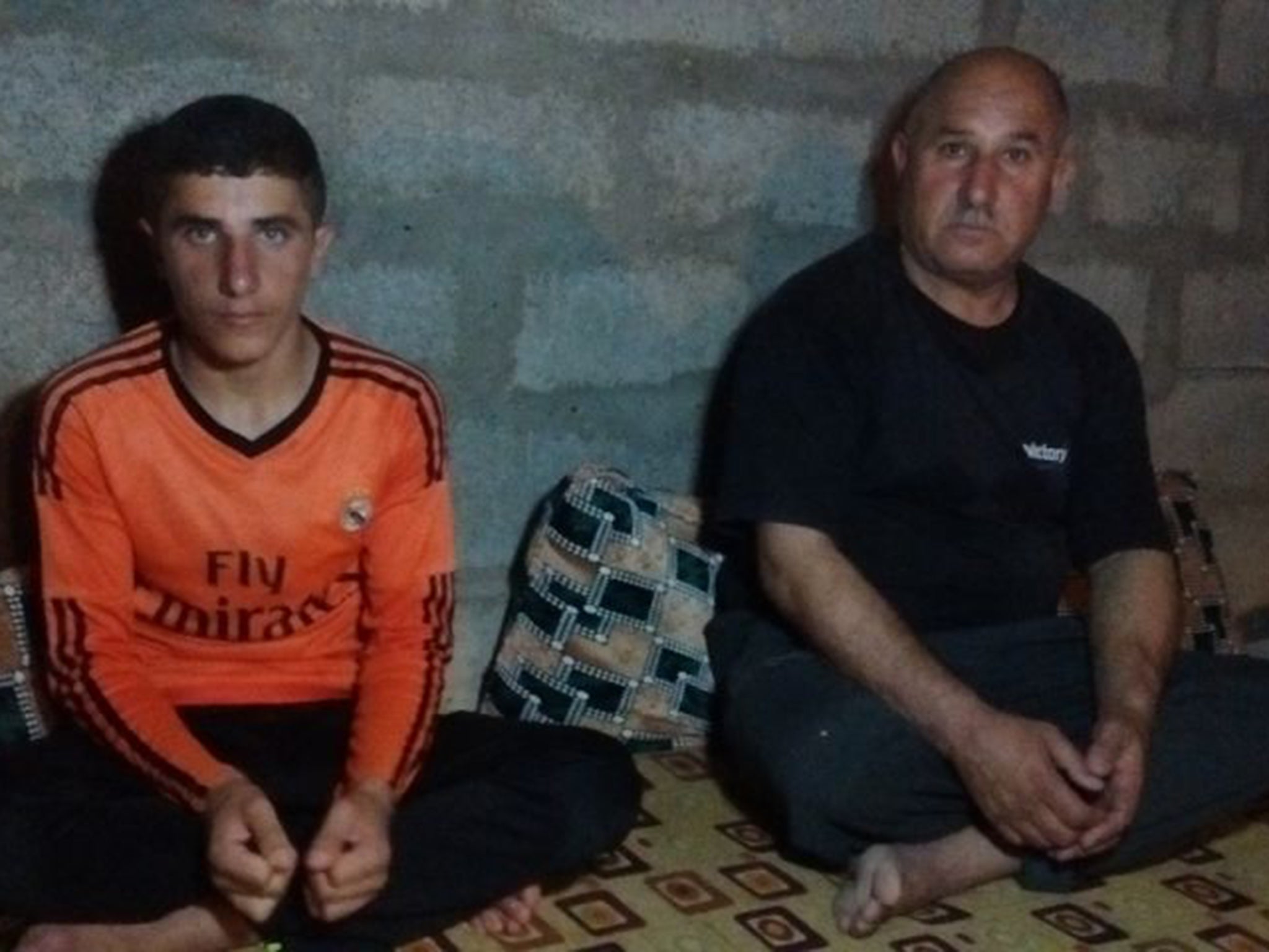 Khatab Haji, 15, with his father Haji Talo