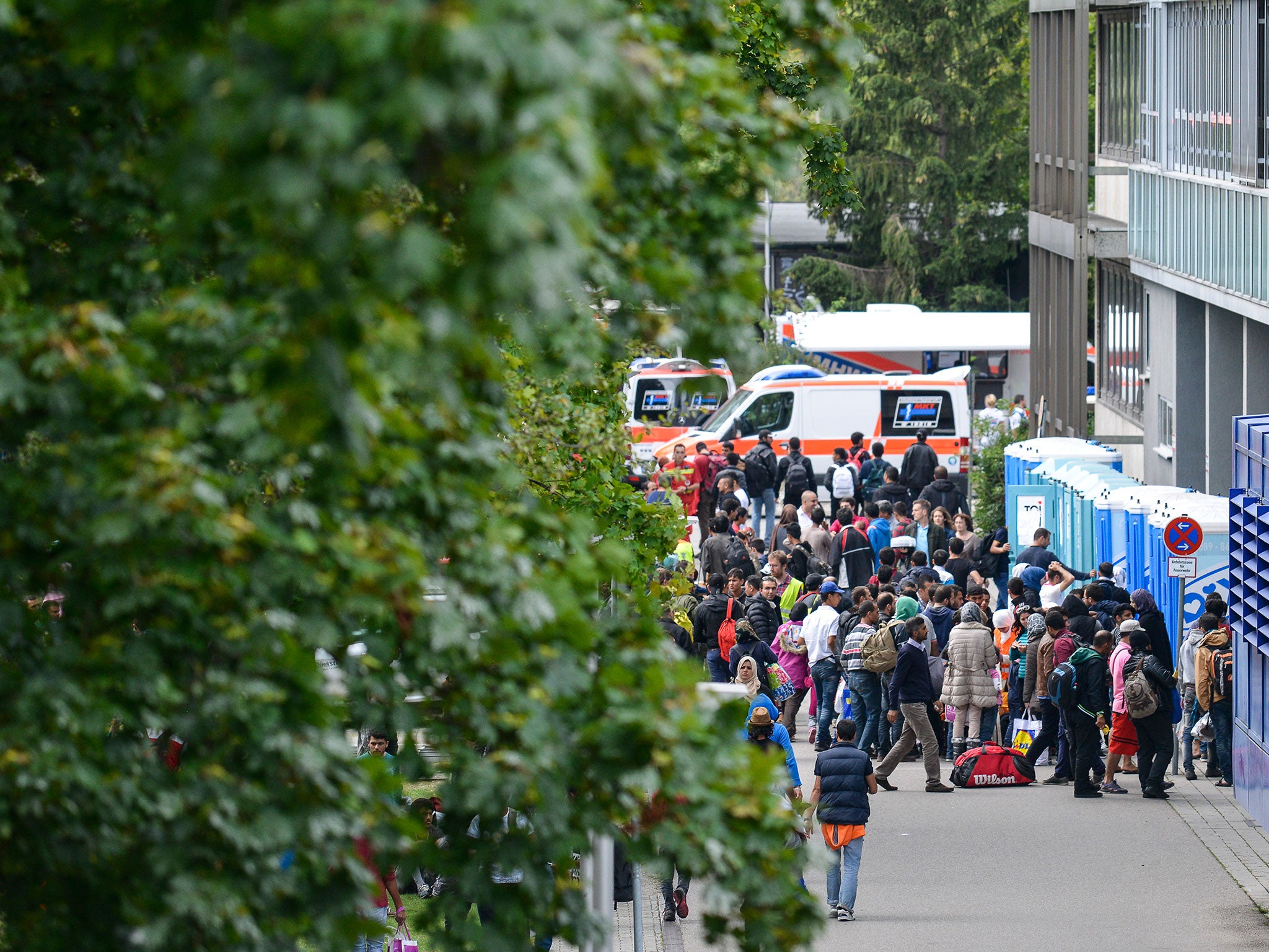 Migrants gather at a tent city near Munich Hauptbahnhof railway station