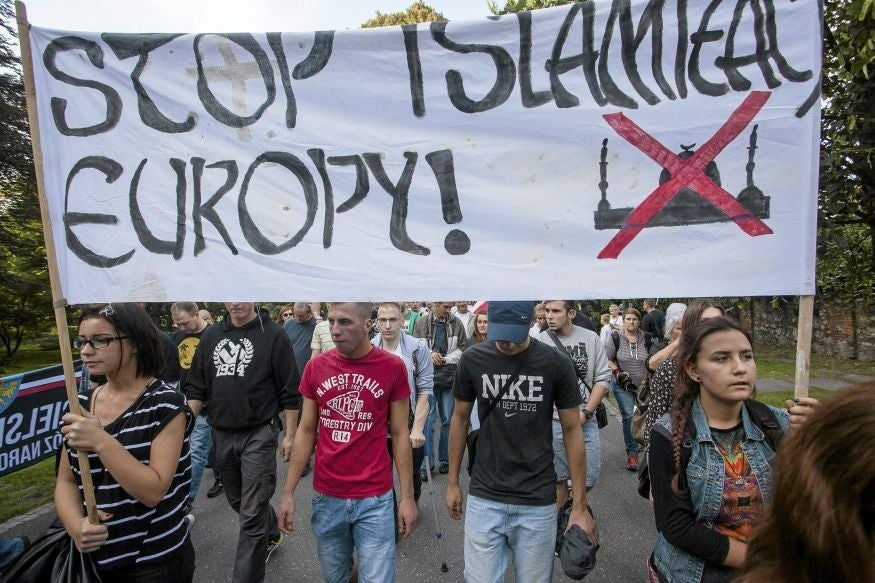 Protesters from far right organisations hold a banner which reads, "Stop the Islamization of Europe" during their protest against refugees in Krakow (Image: Reuters)