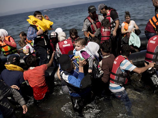 Syrian refugees arrive on the shores of the Greek island of Lesbos on September 11, 2015