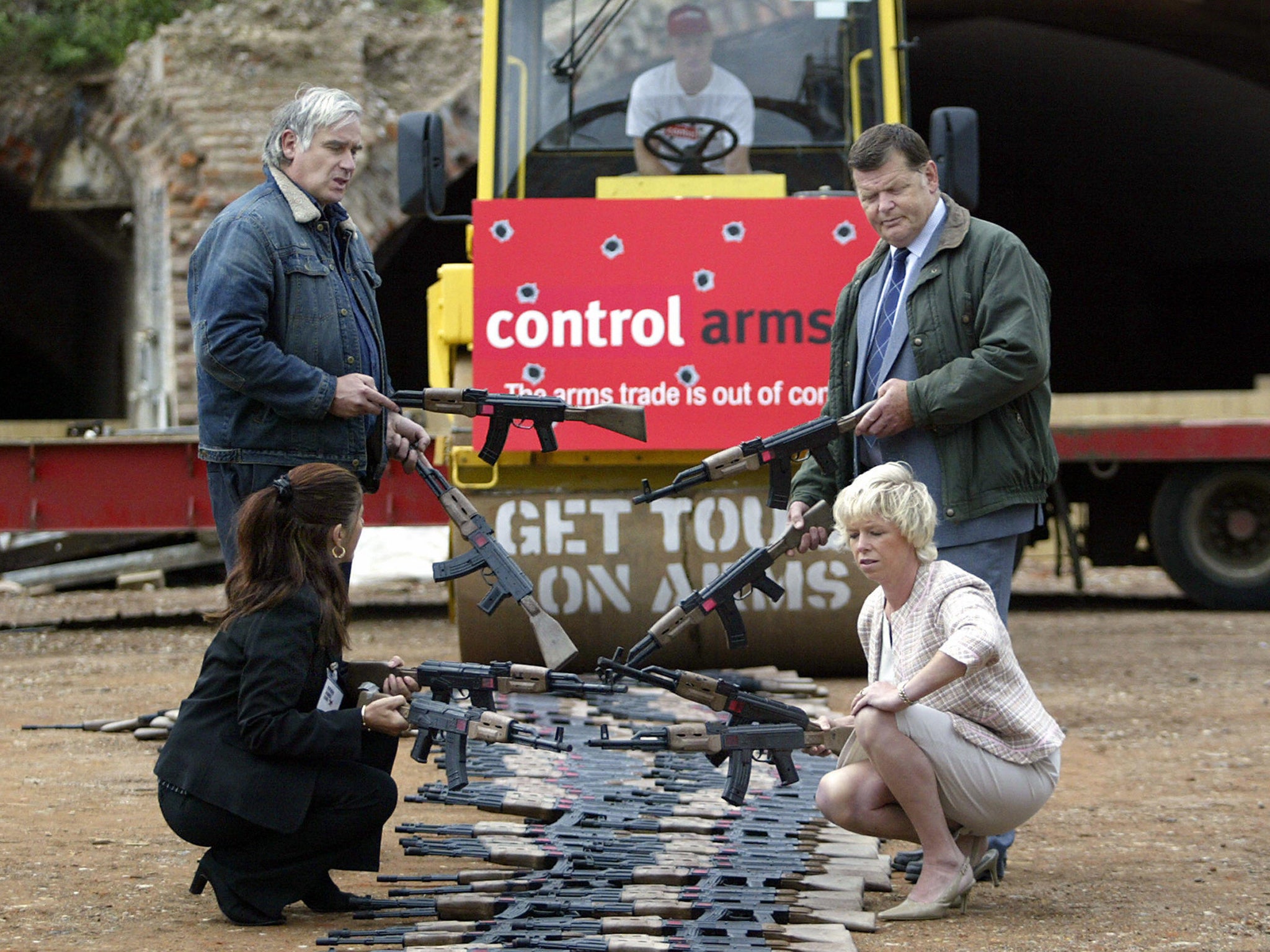 Parents from around the world who lost their children to armed violence gather to destroy symbolic guns as part of International Gun Destruction Day in 2004