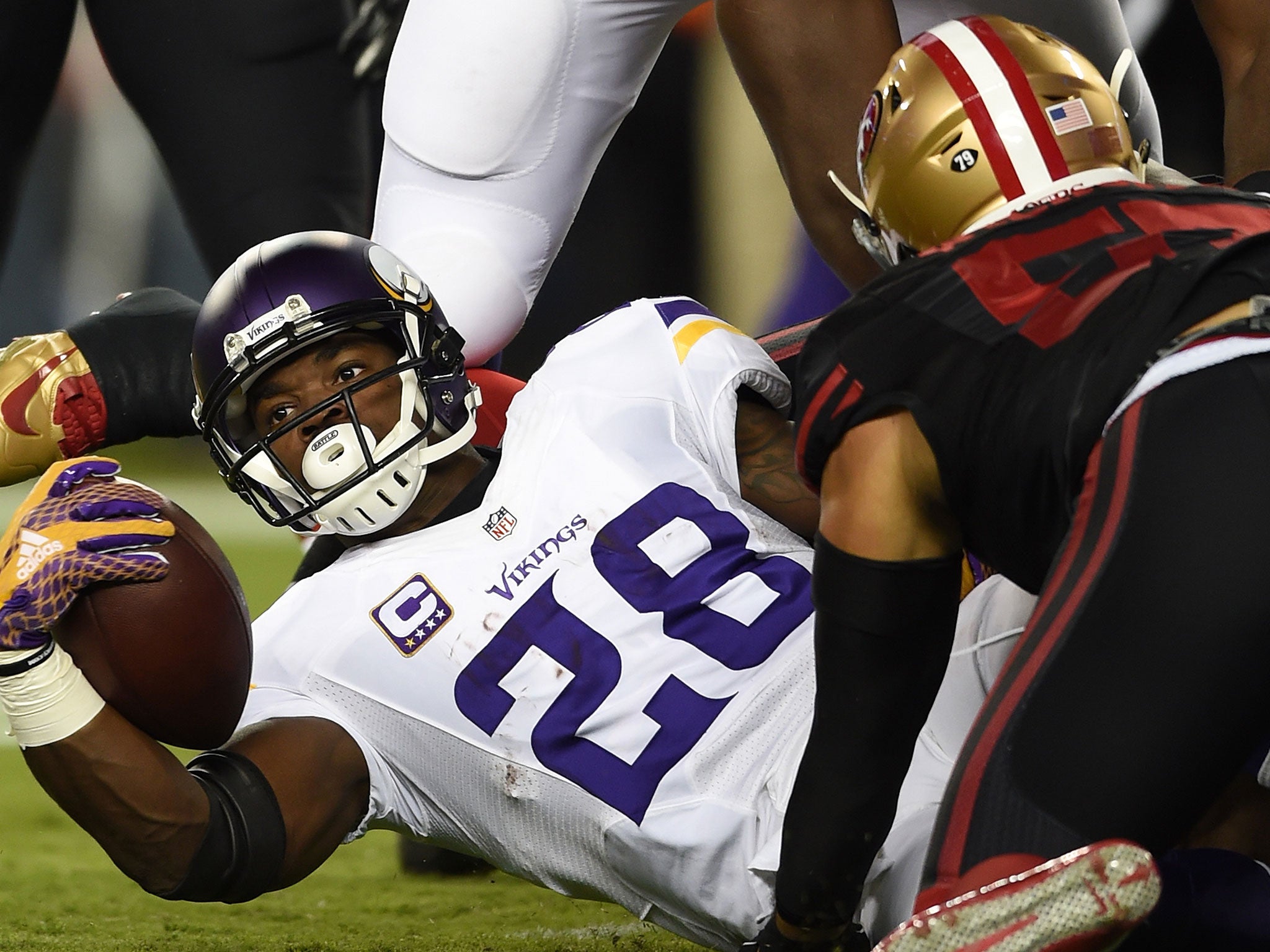 Adrian Peterson played his first game in more than a year as Minnesota lost to San Francisco