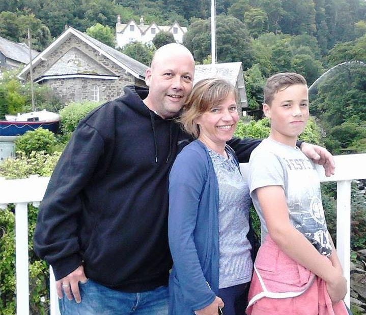 Olly with his parents Sean and Pippa Crocker who praised their 'gorgeous boy' on Facebook