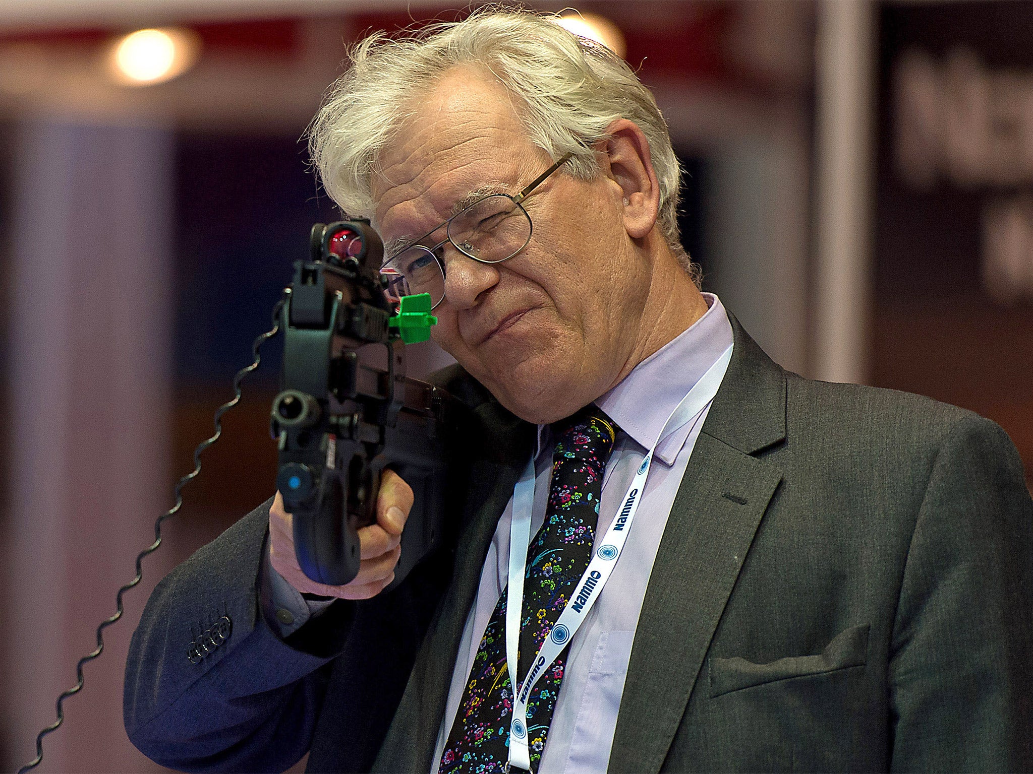 A visitor inspects a rifle at the FN Herstal stand (Getty)