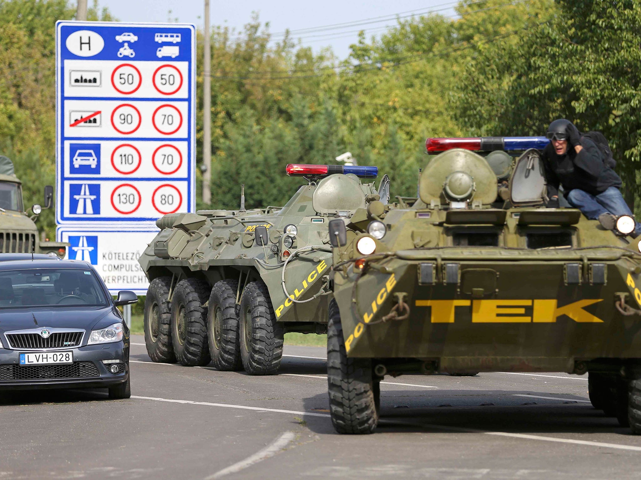Soldiers and riot police have been deployed along Hungary's borders as it accuses its neighbours of 'human smuggling'