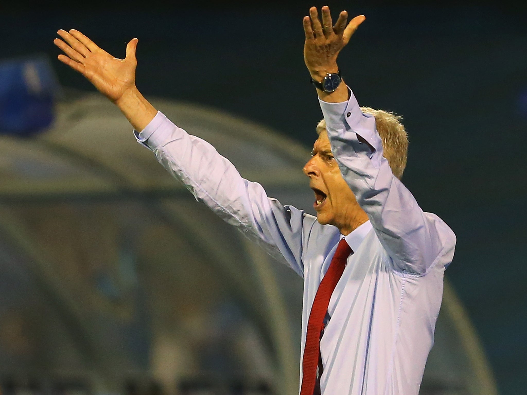 Arsene Wenger reacts on the touchline