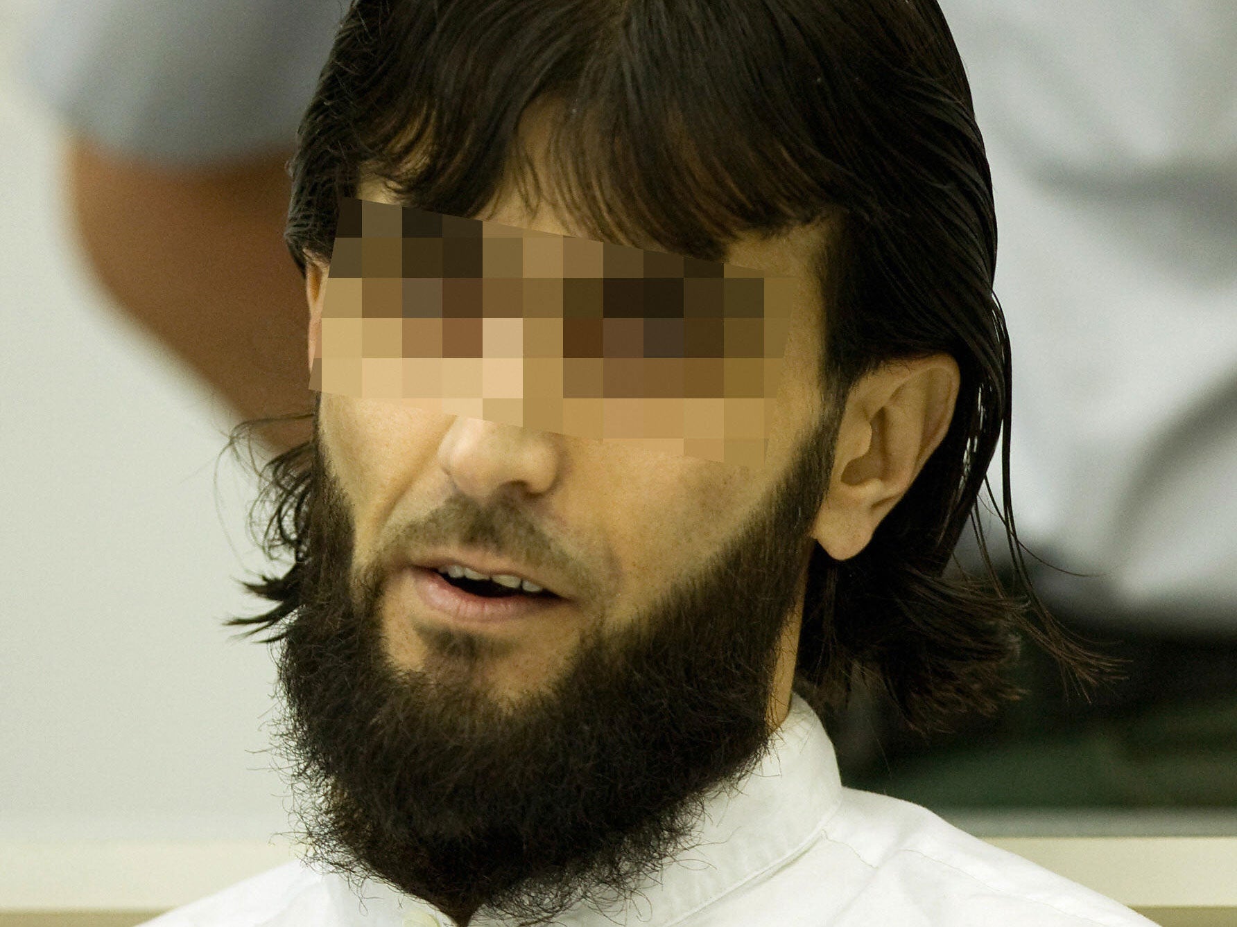 Rafik Y waits for the verdict during his trial for plotting to kill the Iraqi Prime Minister. A German court requested that his face be obscured