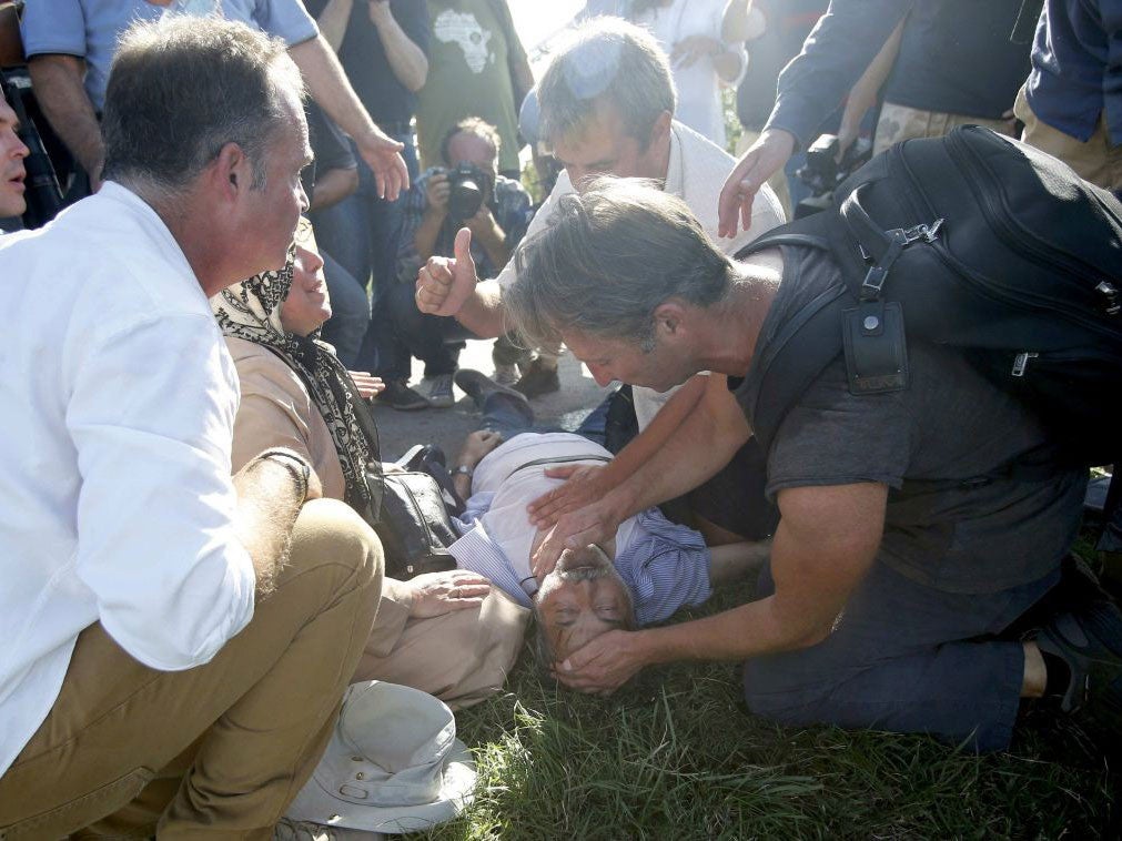 The man was later seen by paramedics and taken to hospital after journalists ran to find an ambulance