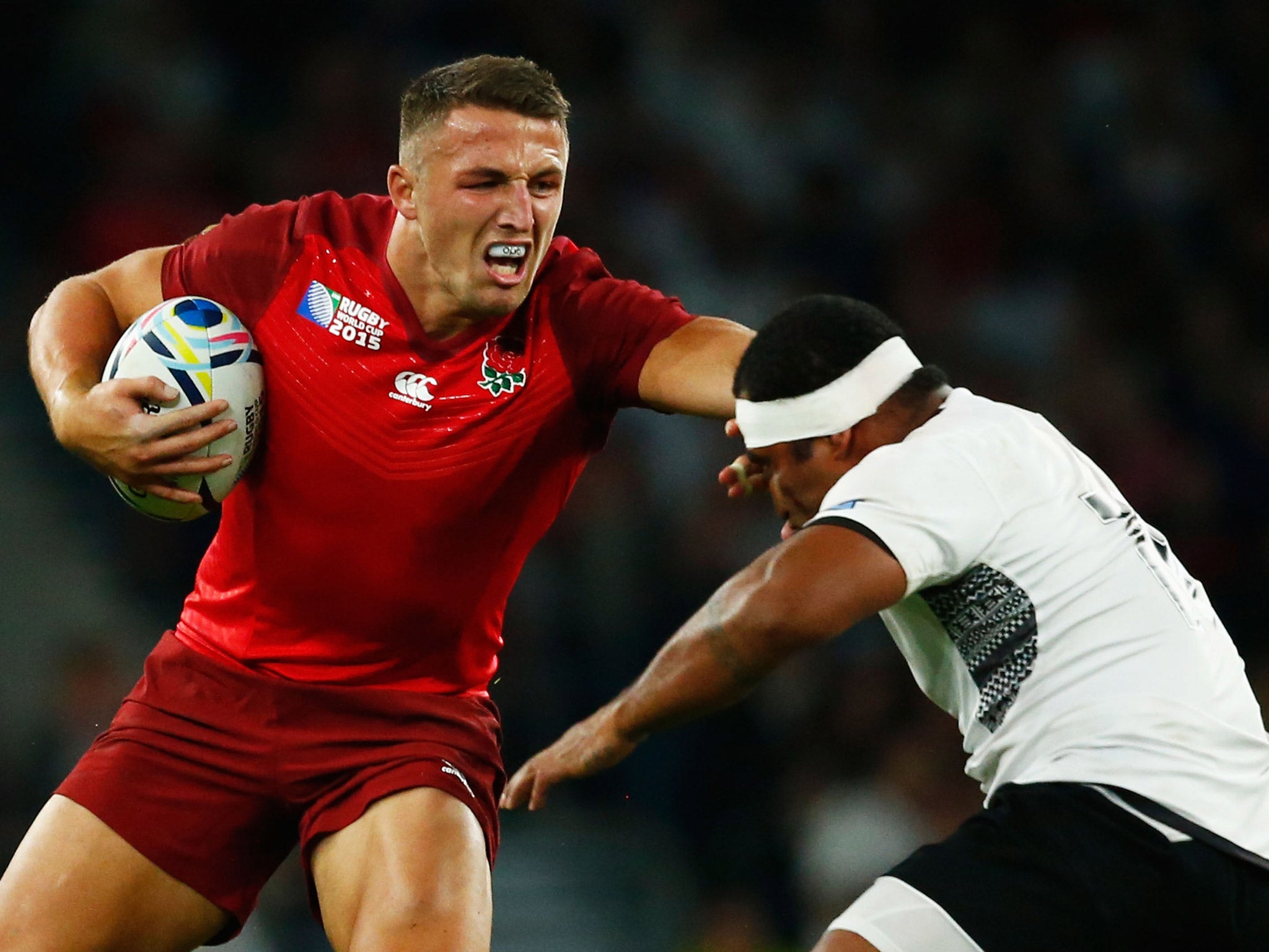 Sam Burgess fends off Tuapati Talemaitoga