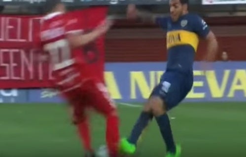 Carlos Tevez clashes with Ezequiel Ham