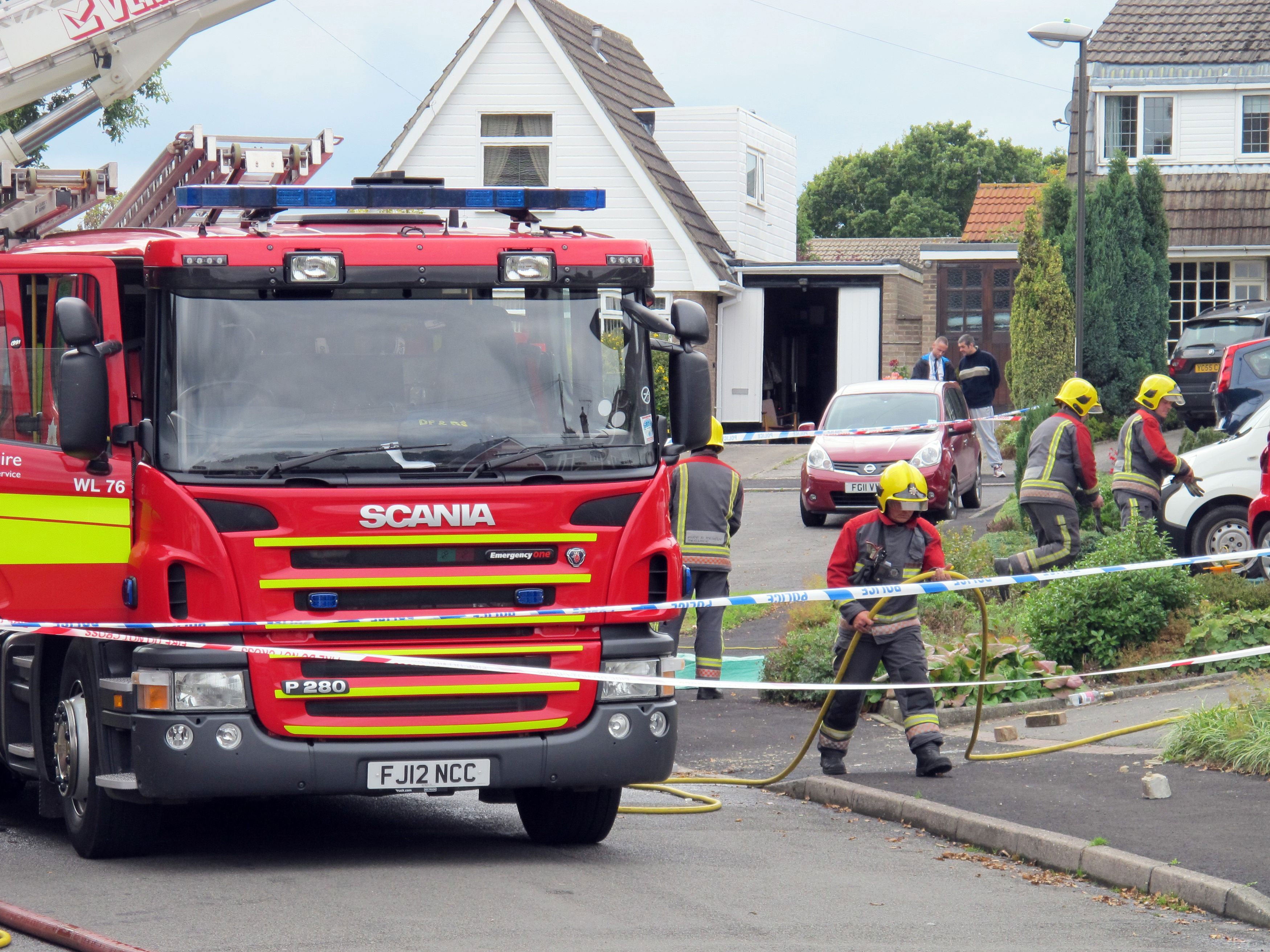 Fire crews at the house in Riddings, near Alfreton where two people died in a fierce house fire