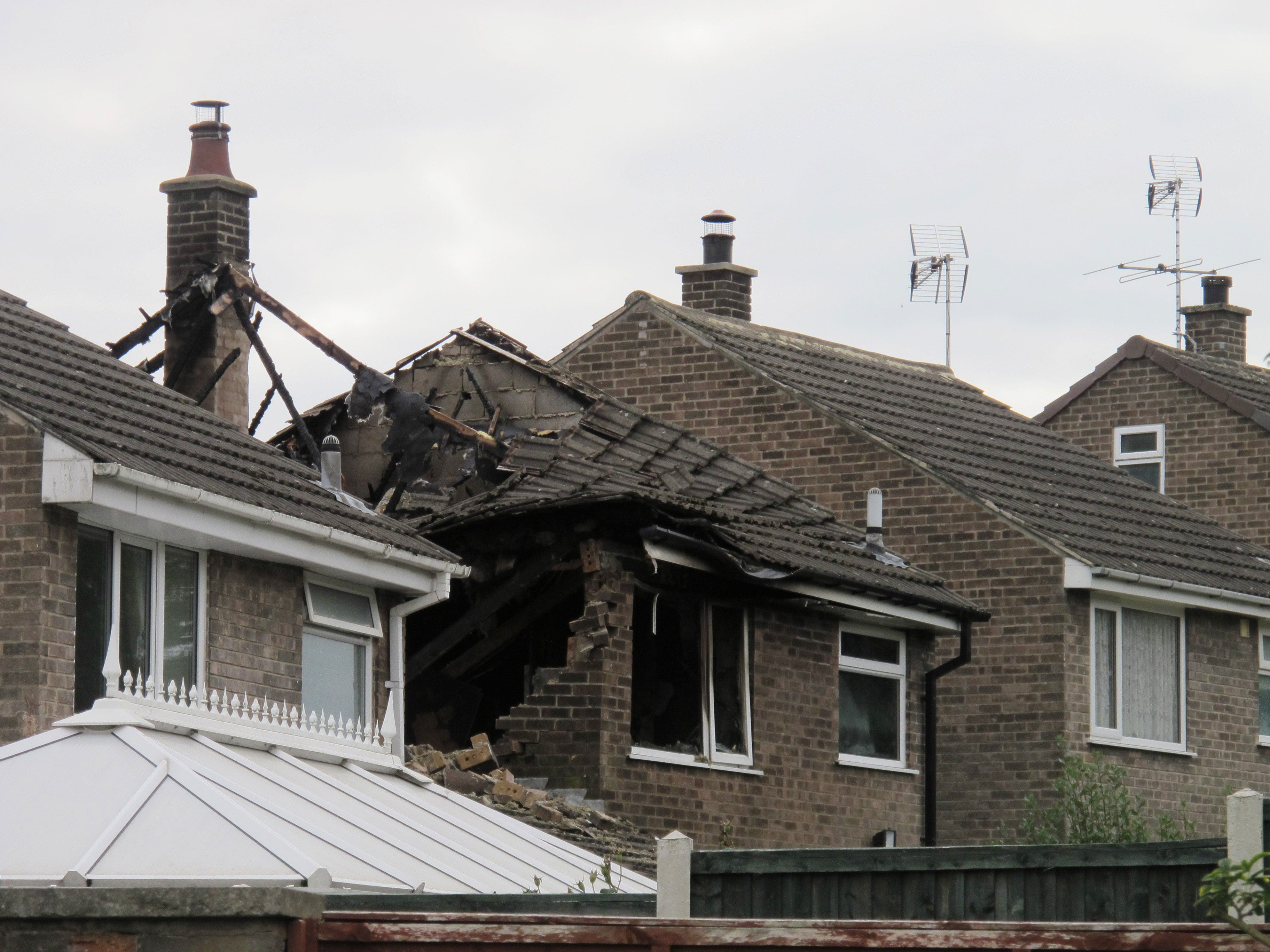 Damage at the house in Riddings, near Alfreton where two people died in a fierce house fire after a suspected explosion.