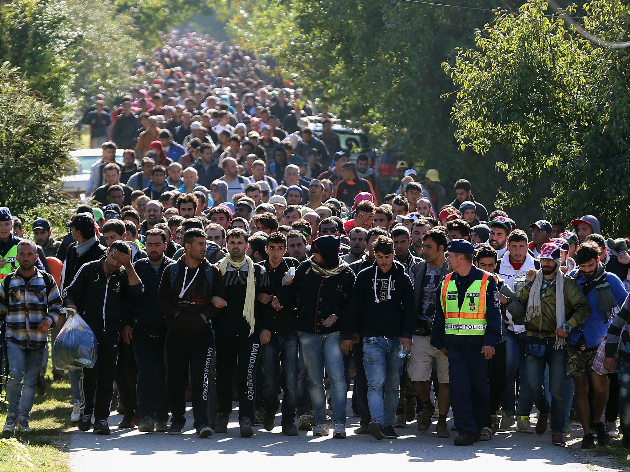 Refugees who arrived by train at Hegyeshalom on the Austrian and Hungarian border