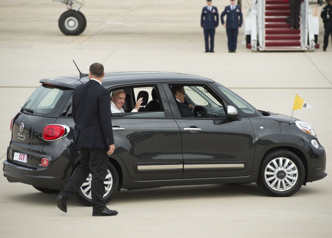 The Pope waves from his Fiat 500 shortly after landing at Joint Base Andrews (AFP)