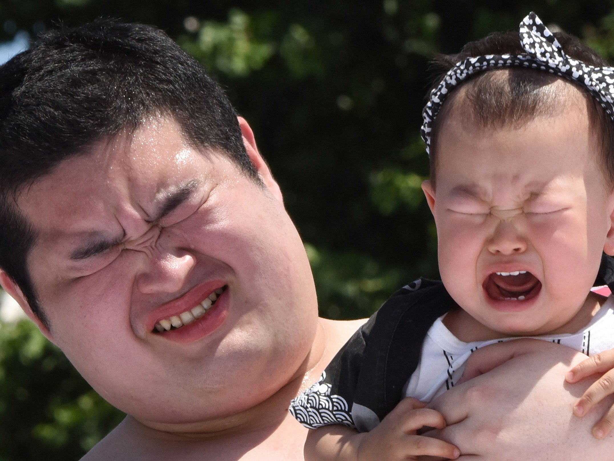 A baby cries at the 'Baby-cry sumo' competition at Tokyo's Sensoji Temple