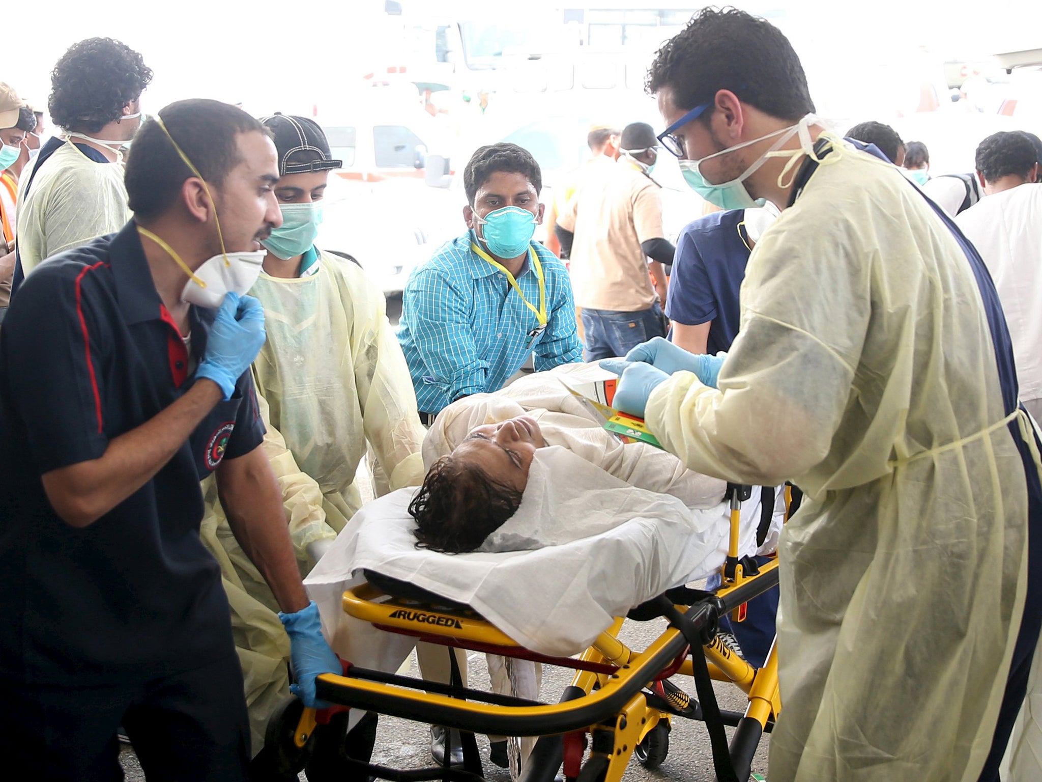 A medic tends to one of the more than 300 people injured in the stampede