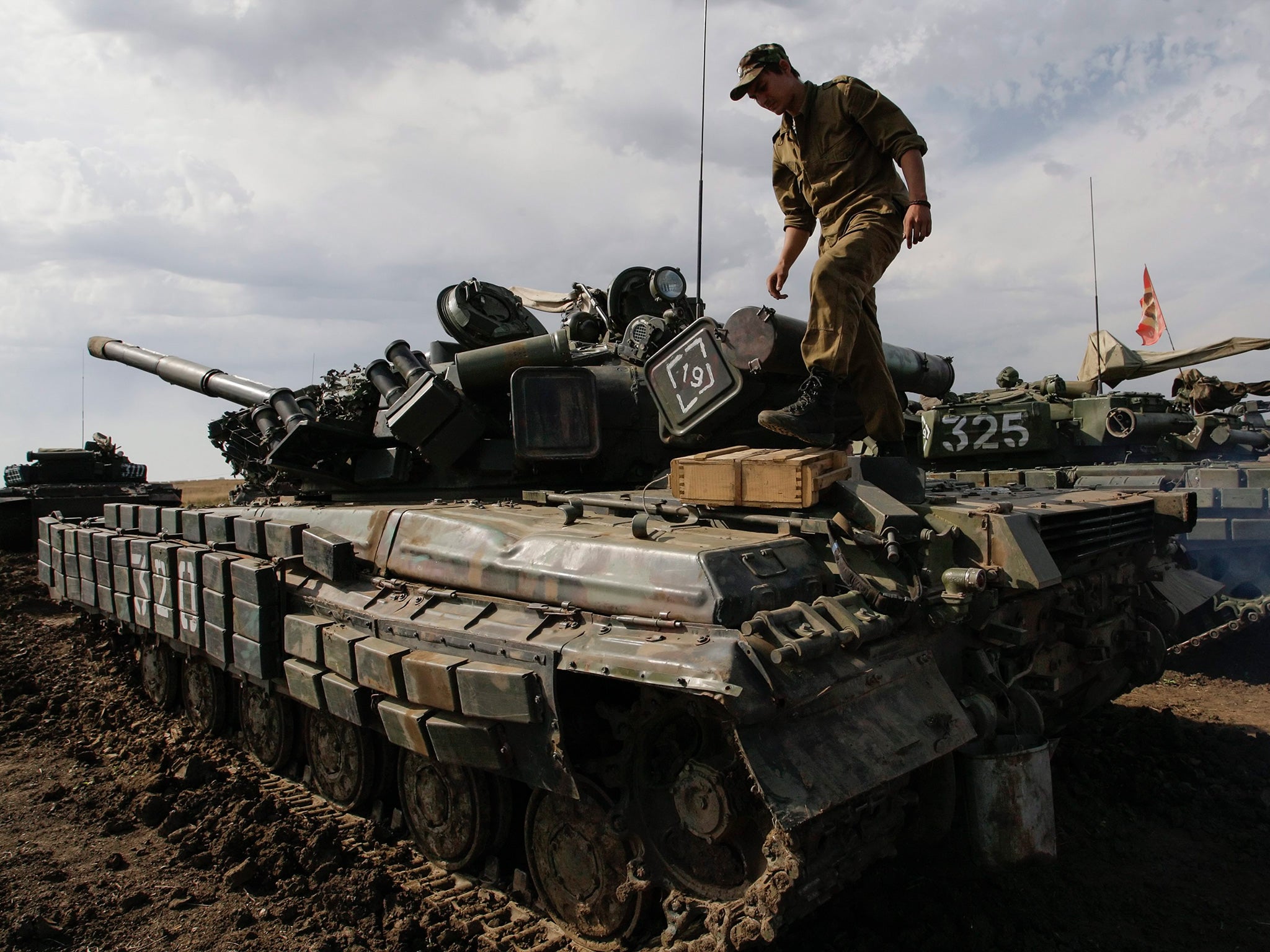 Pro-Russian militants in action with a tank during their training on a shooting range near of Torez city, about 75 kilometers from of Donetsk