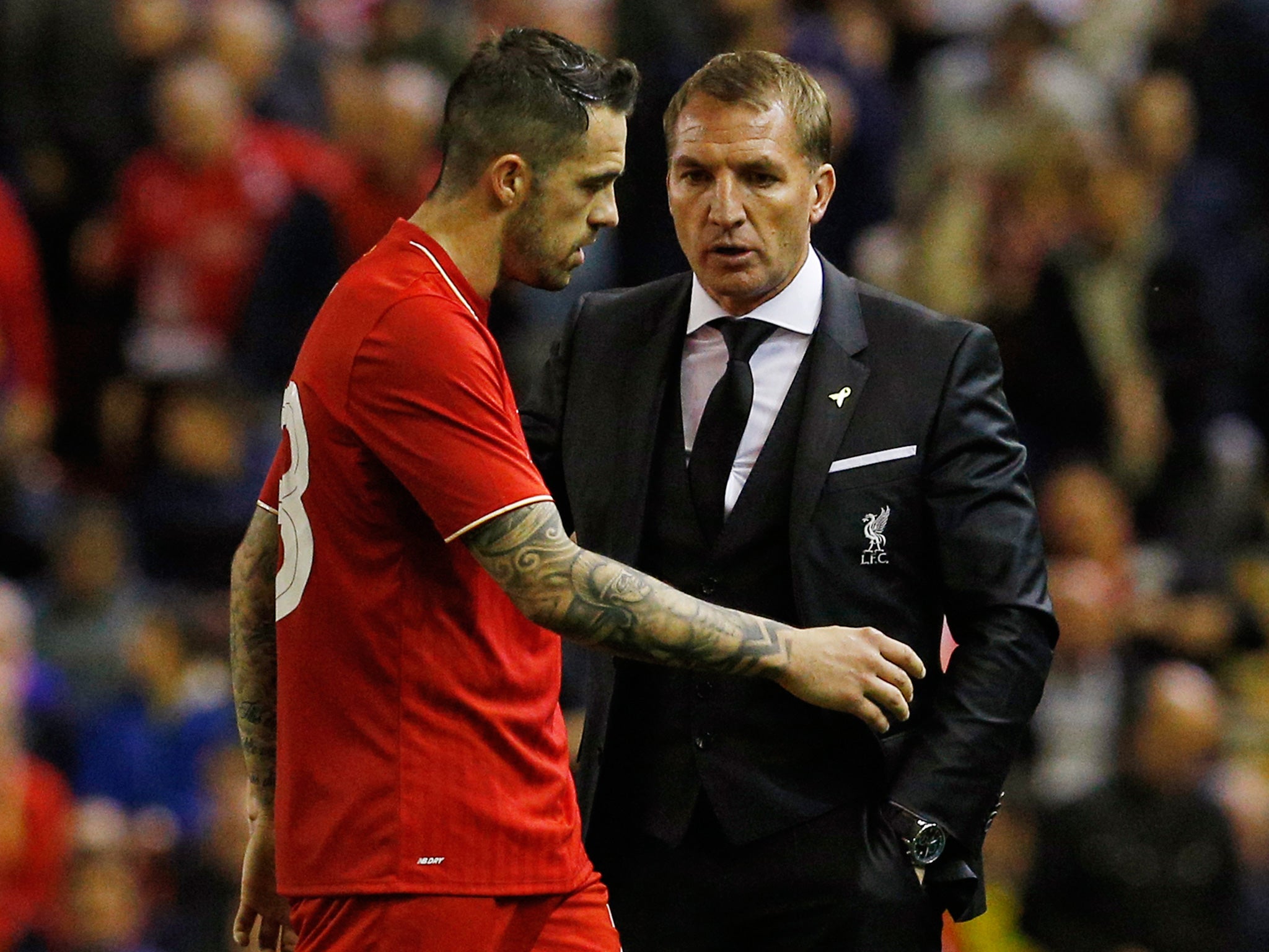 Brendan Rodgers speaks with striker Danny Ings