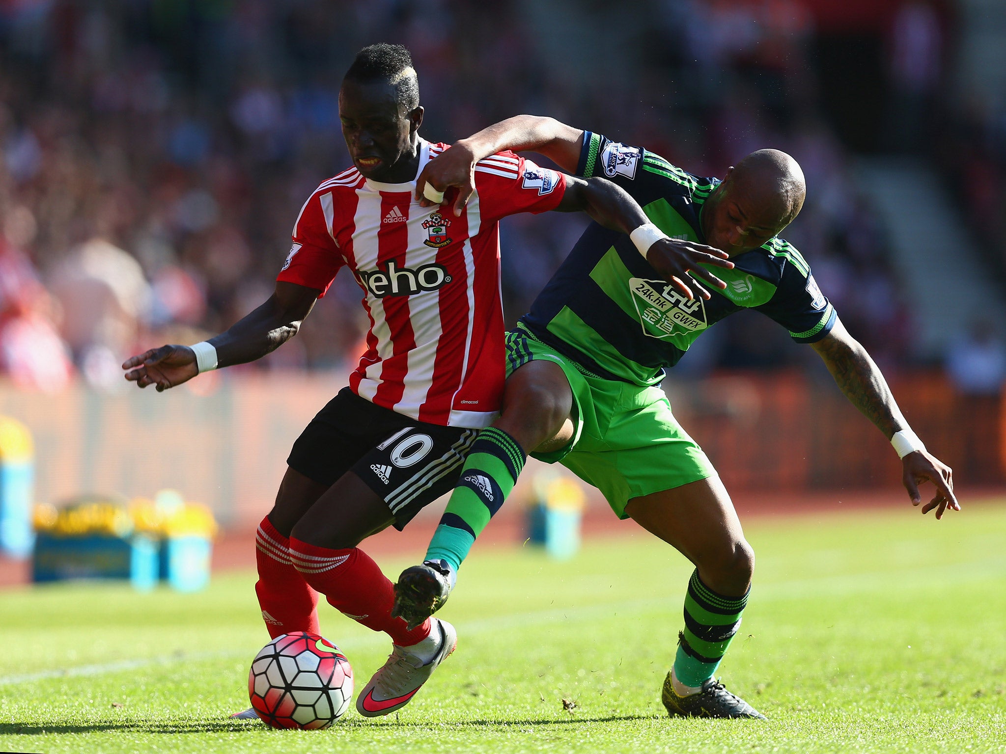 Sadio Mane tangles with Andre Ayew