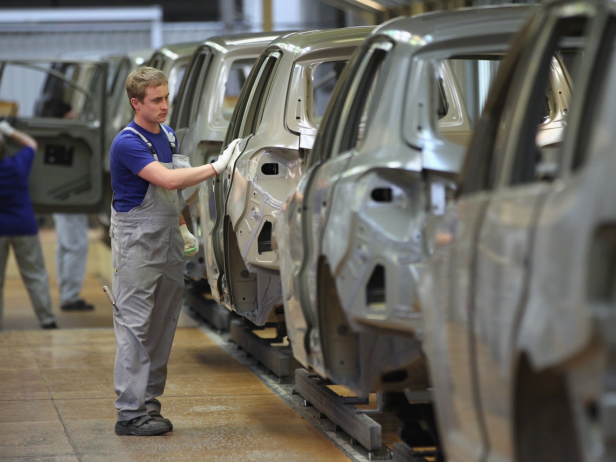 A worker on the shop floor at the Volkswagen factory in Wolfsburg, Germany