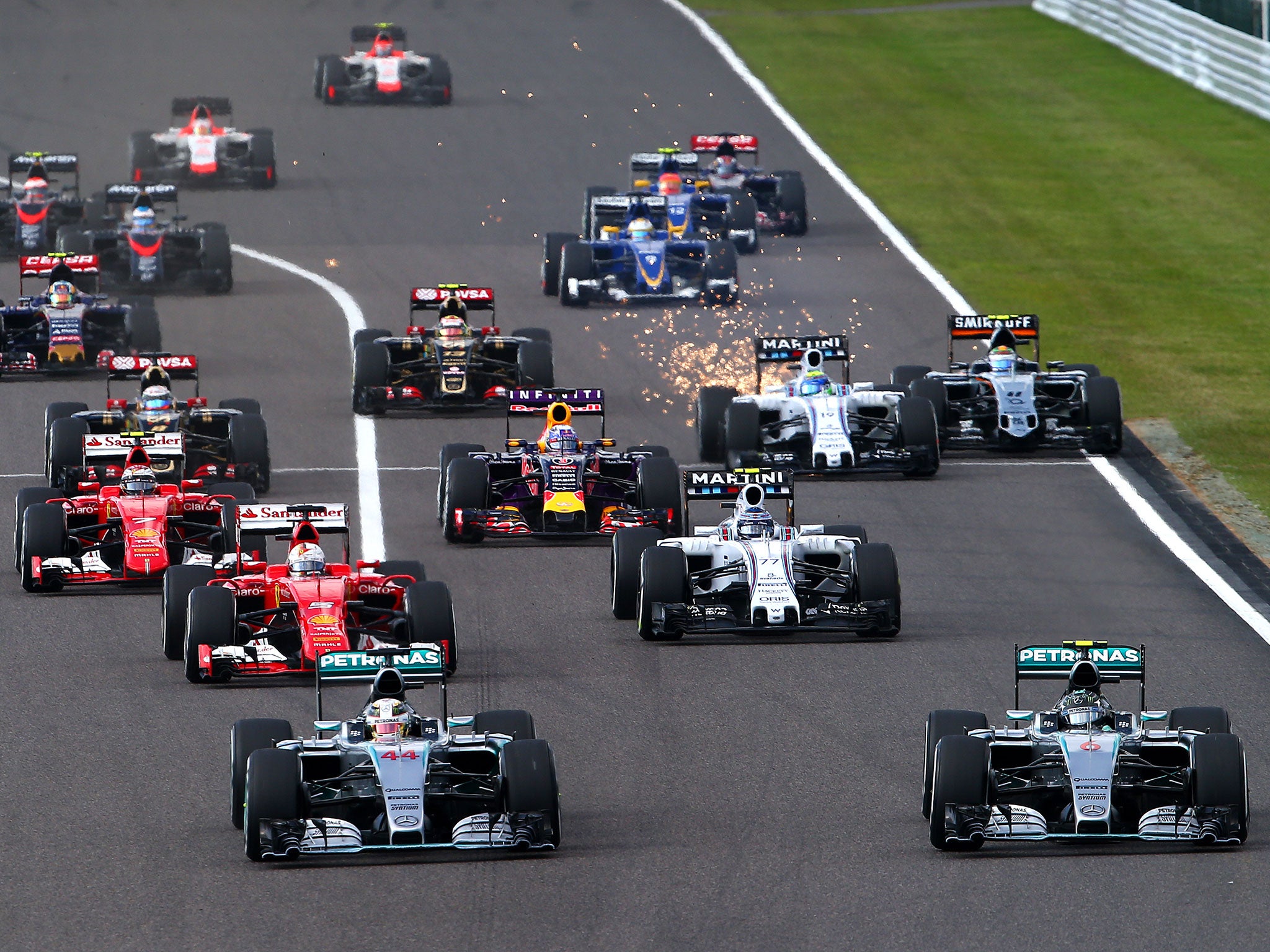 Lewis Hamilton challenges Nico Rosberg at the start of the Japanese Grand Prix