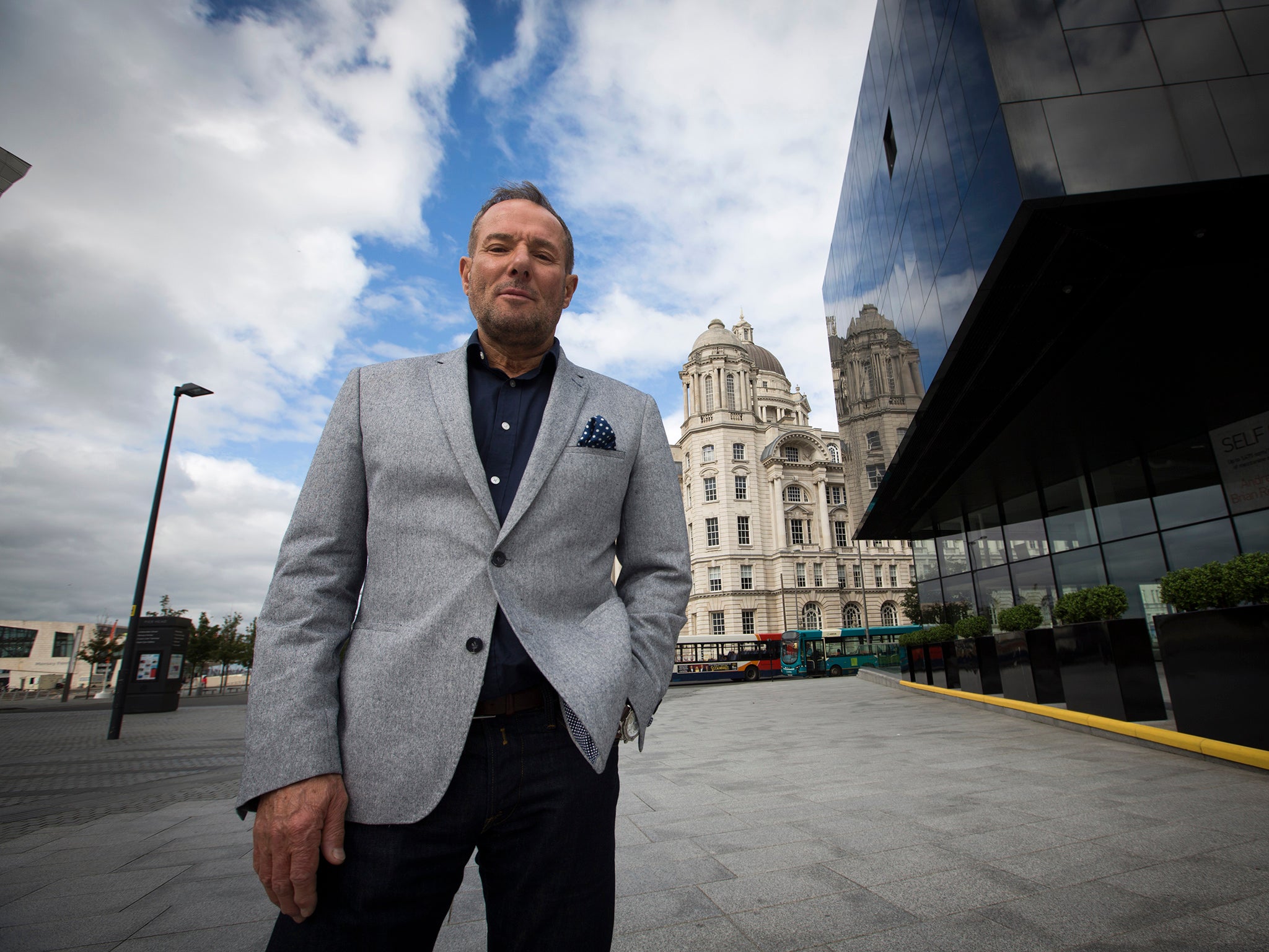 Former left-wing British politician, Derek Hatton, pictured in his home city of Liverpool, with the iconic Liver Building in the background. (Photo credit Colin McPherson)