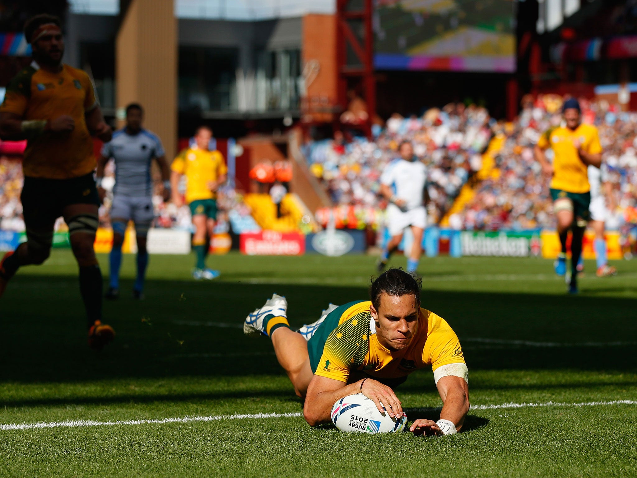 Australia centre Matt Toomua crosses for a try during the 2015 Rugby World Cup Pool A match between Australia and Uruguay at Villa Park