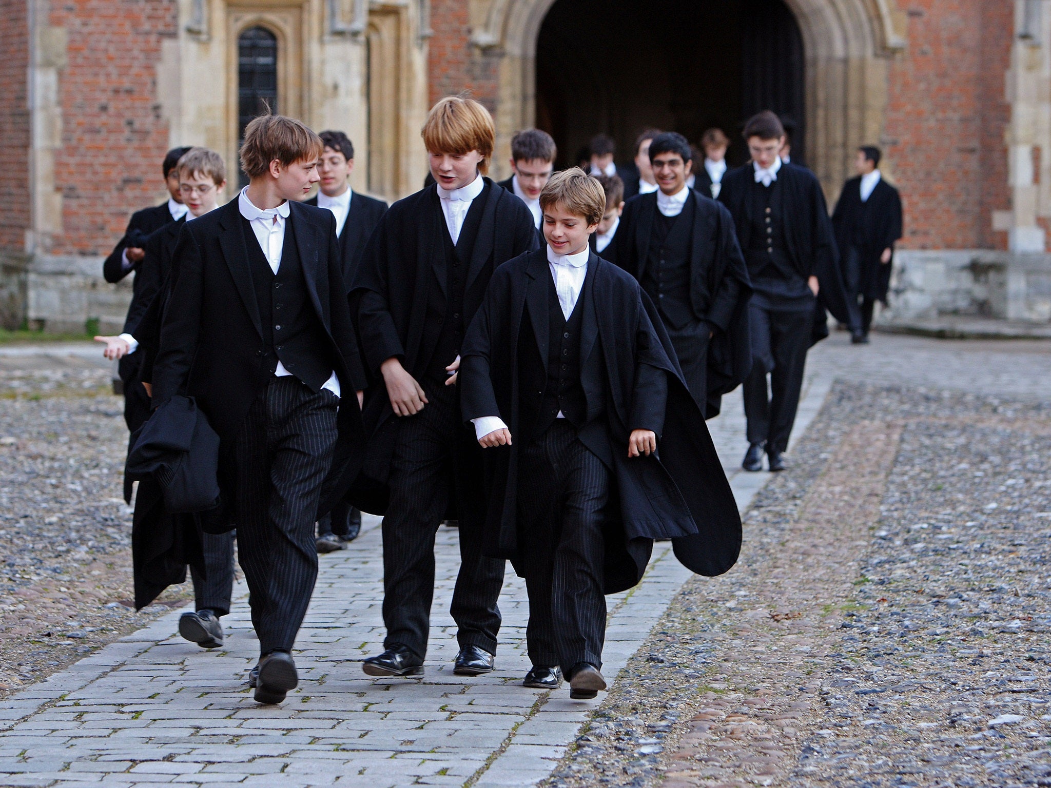 Boys make their way to classes across the historic cobbled School Yard of Eton College. File photo