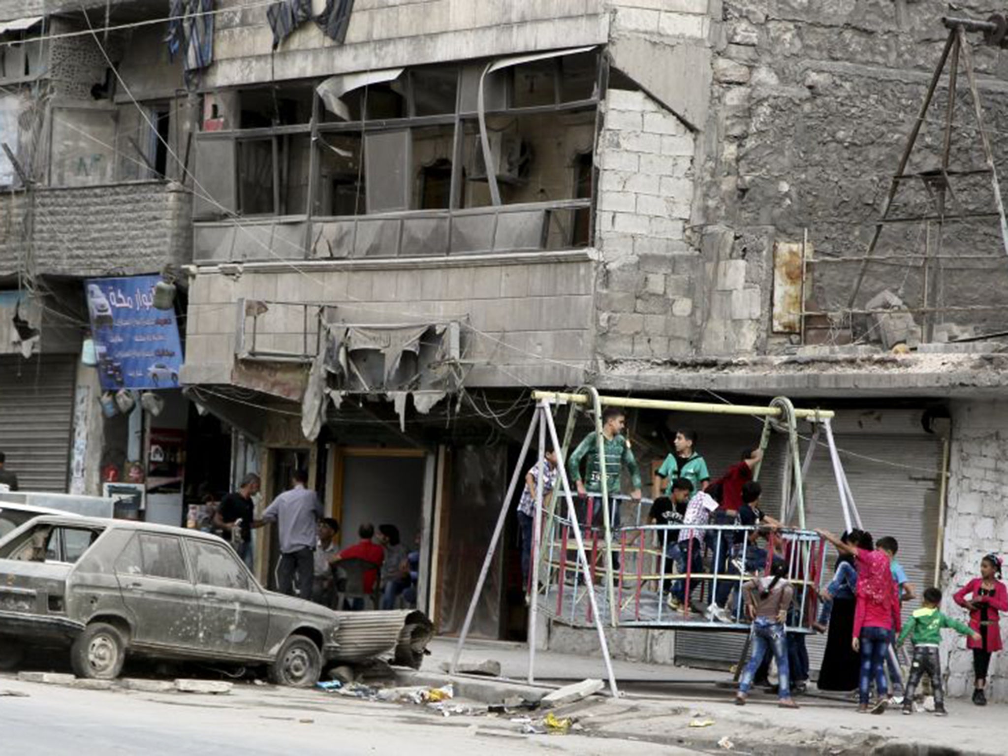 Children playing during Eid celebrations in Aleppo, Syria, on Sunday