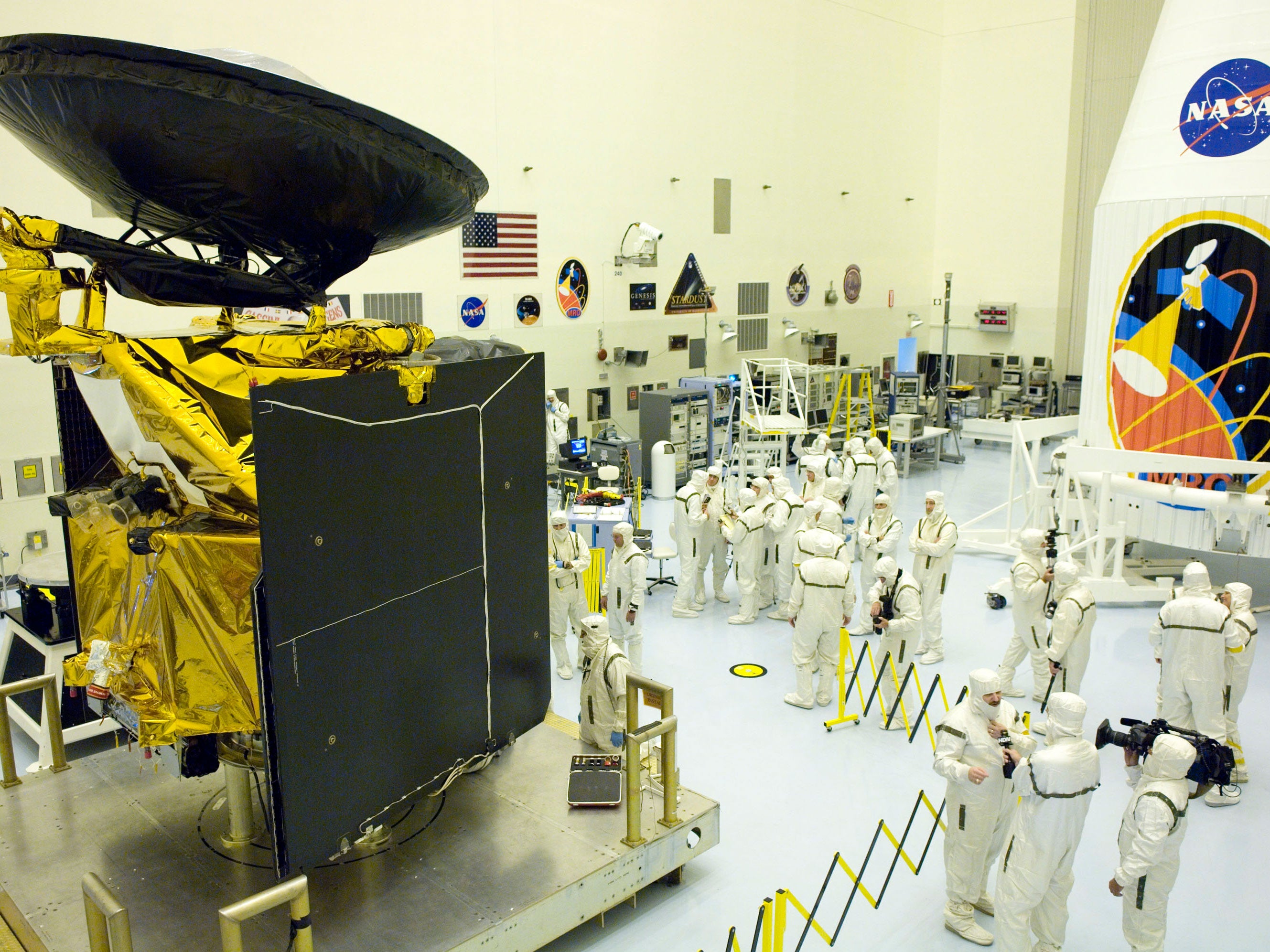 NASA workers answer questions from the media and work on the Mars Reconnaissance Orbiter (MRO) in the Hazardous Payload Service Facility at the Kennedy Space Center July 20, 2005 in Cape Canaveral, Florida