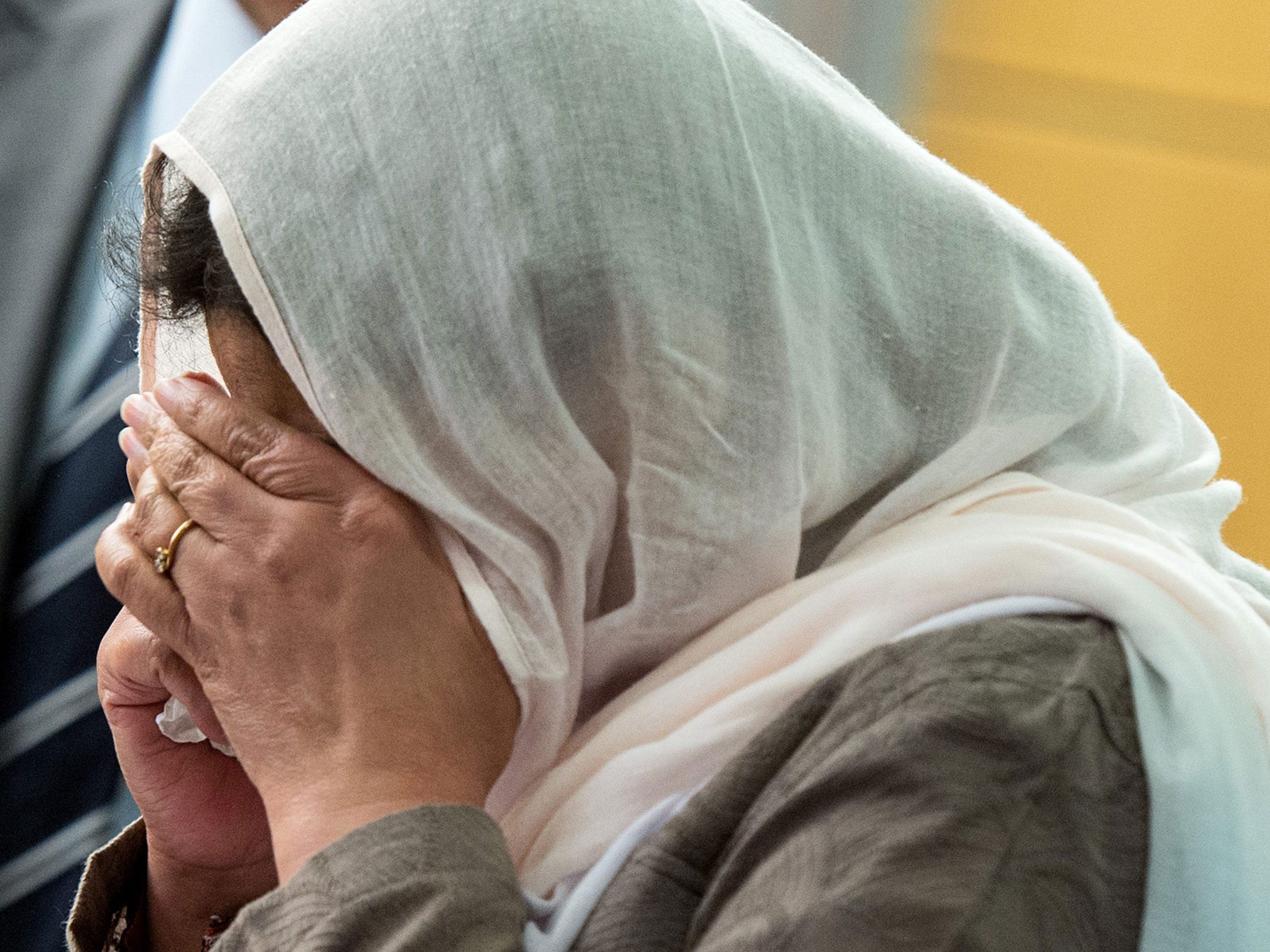 Lareeb's mother covers her face in court