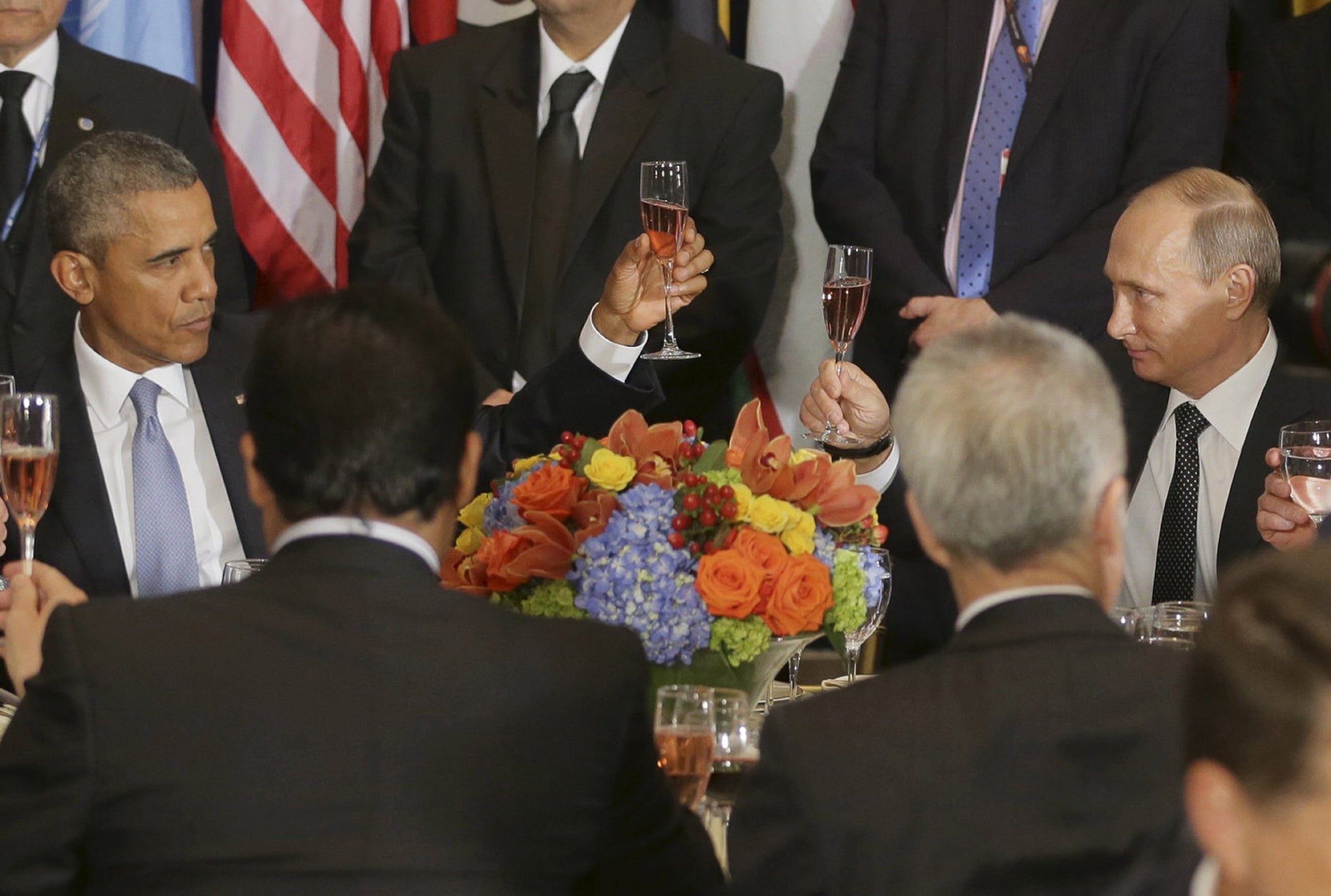 Russian President Vladimir Putin and U.S. President Barack Obama share a toast during the luncheon at the United Nations General Assembly in New York