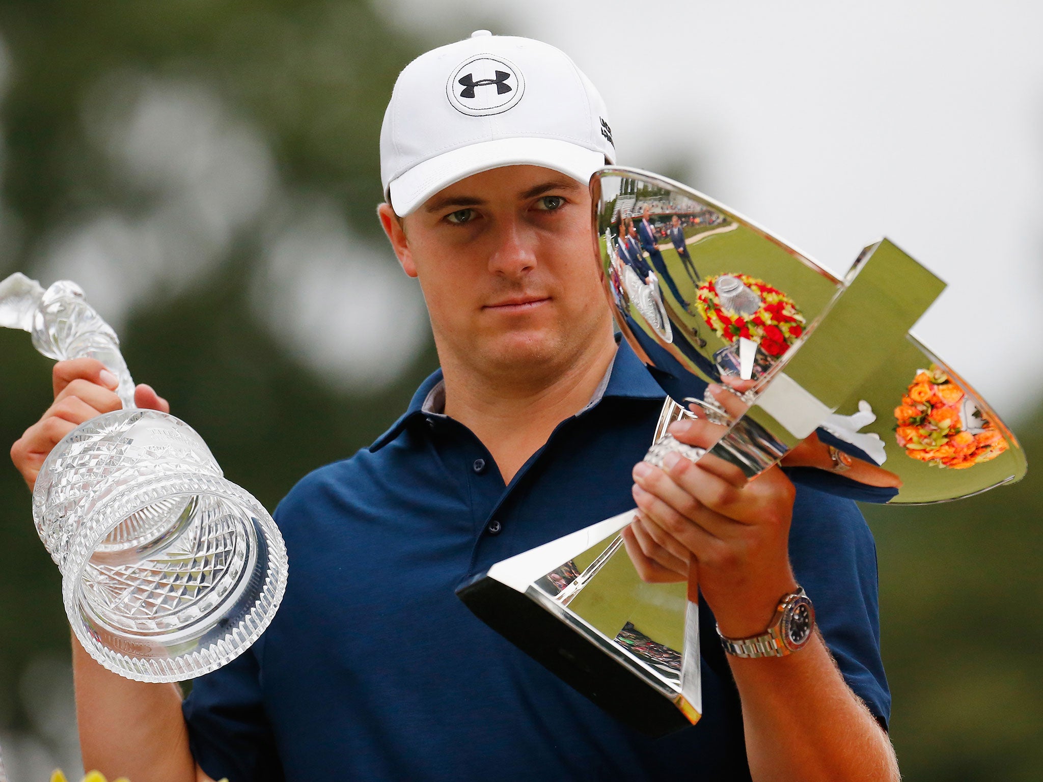 Jordan Spieth poses on the 18th green after winning both the TOUR Championship By Coca-Cola and the FedExCup at East Lake Golf Club