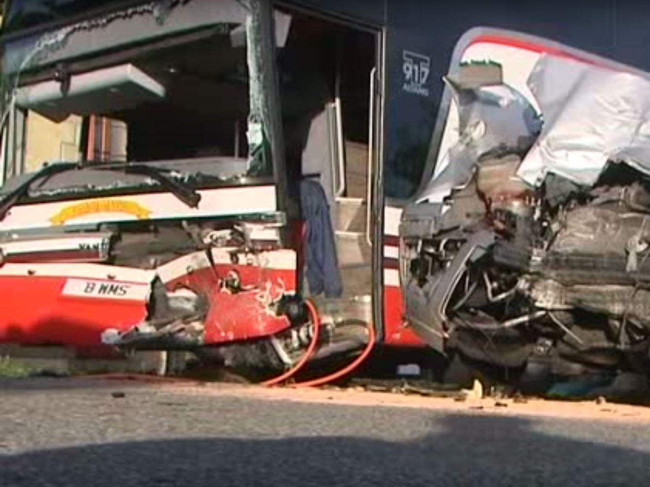 An image showing the damage to the school's bus and the car that crashed into it in Normandy