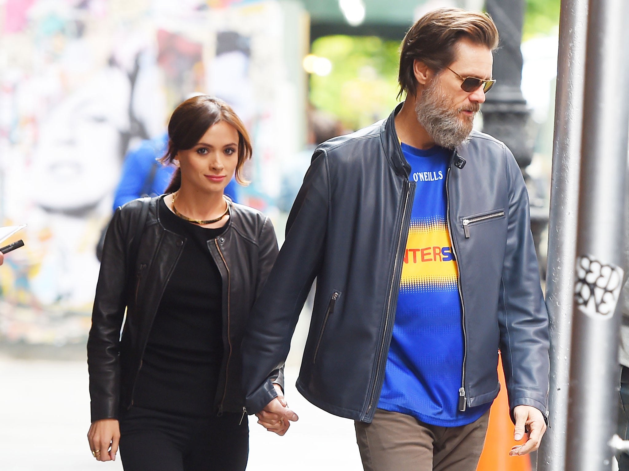 Jim Carrey and his girlfriend, Cathriona White, hold hands while taking a walk in Manhattan