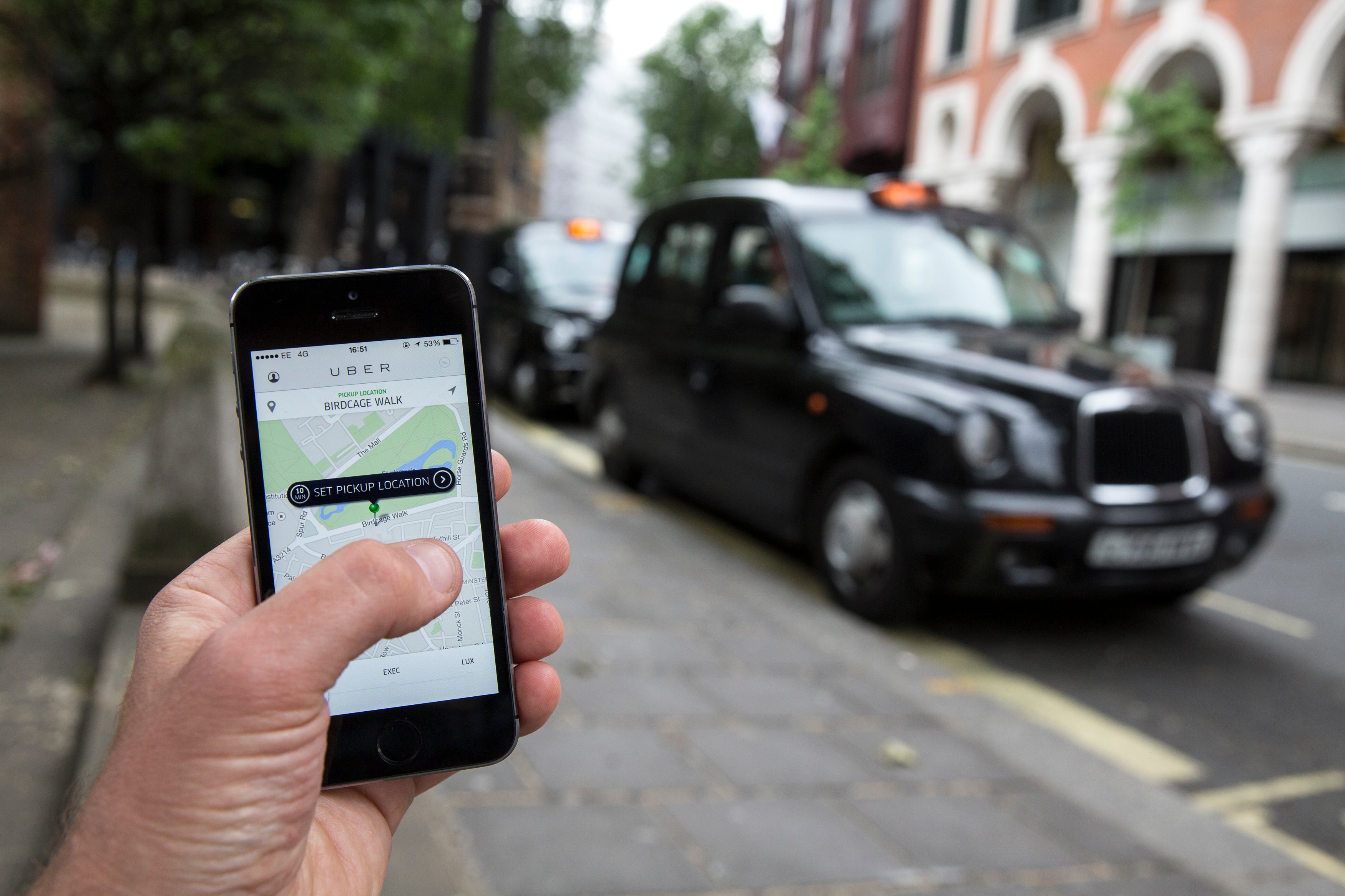 London taxi's line up on The Mall during a protest against a new smart phone app, 'Uber' on 11 June 2014 in London, England.