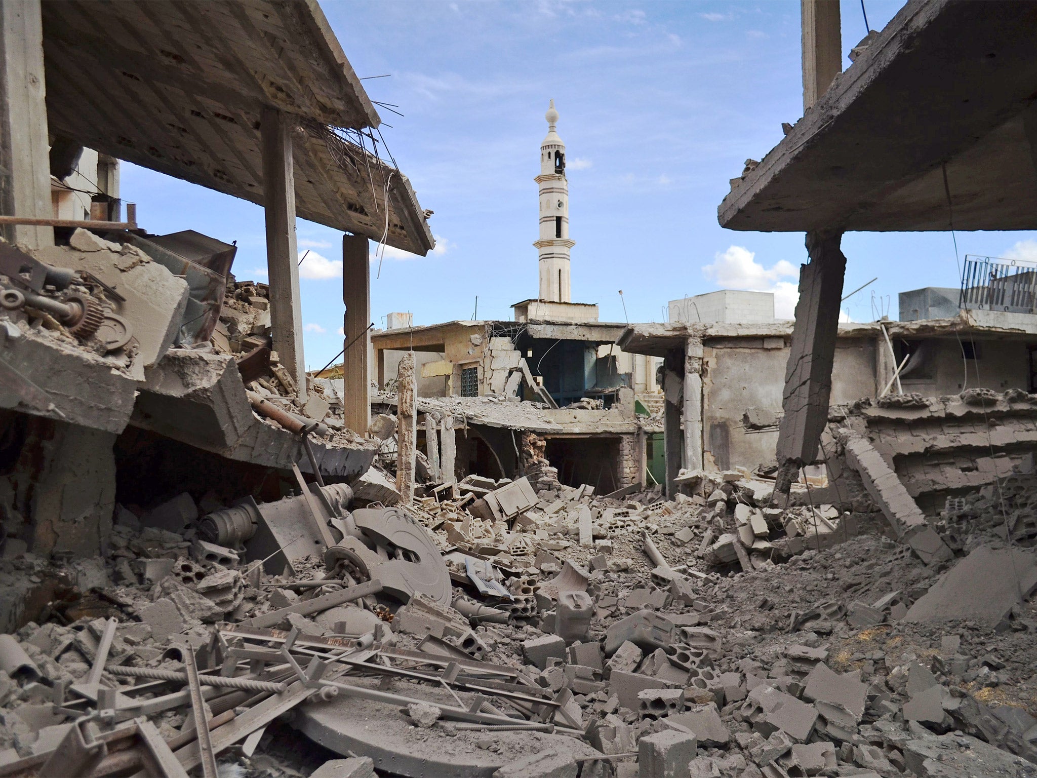 Damaged buildings the Syrian town of Talbiseh, Homs, following the air strikes