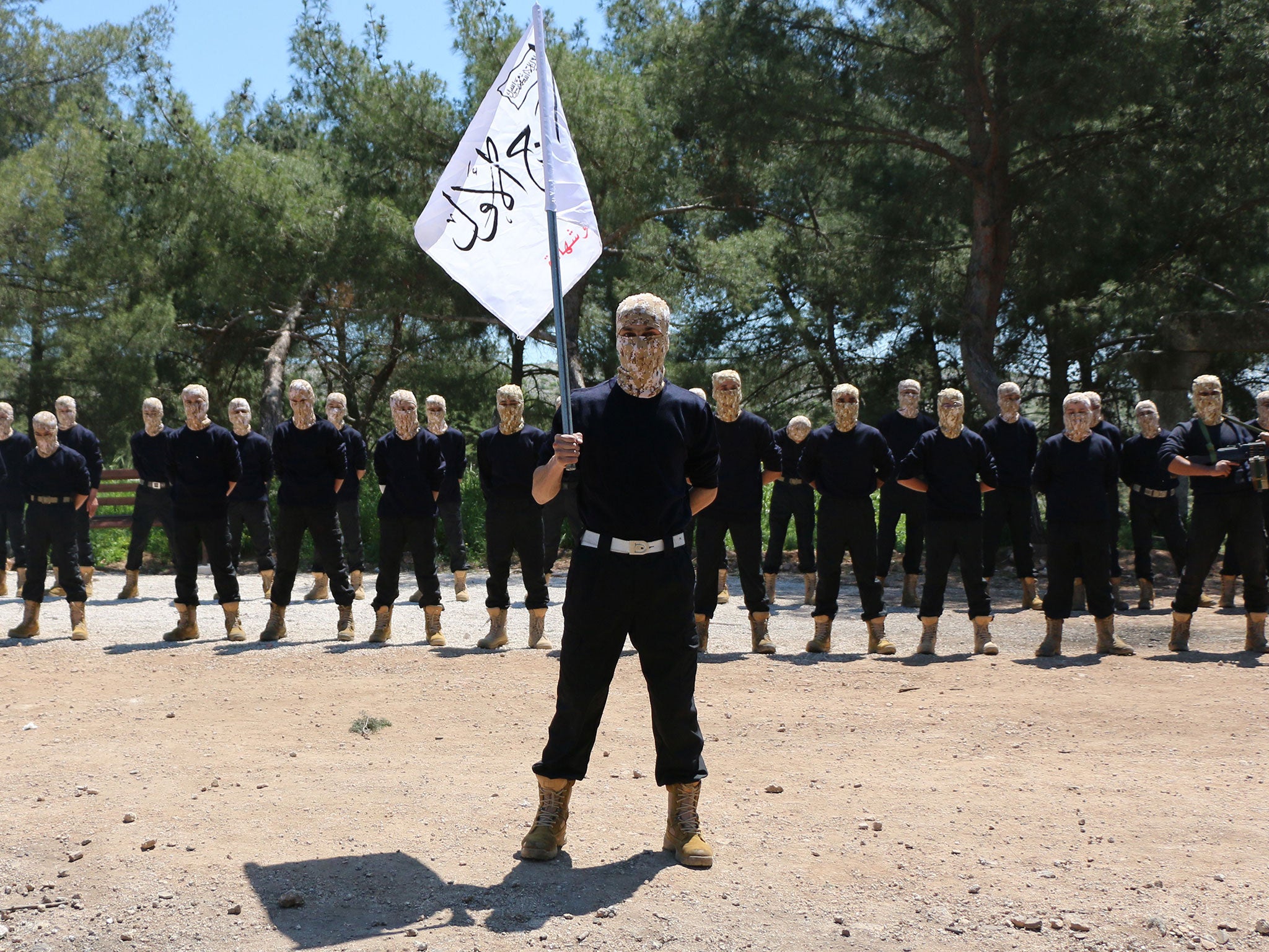 Rebel fighters from the 'First Battalion' under the Free Syrian Army take part in a military training in the rebel-held city of Aleppo