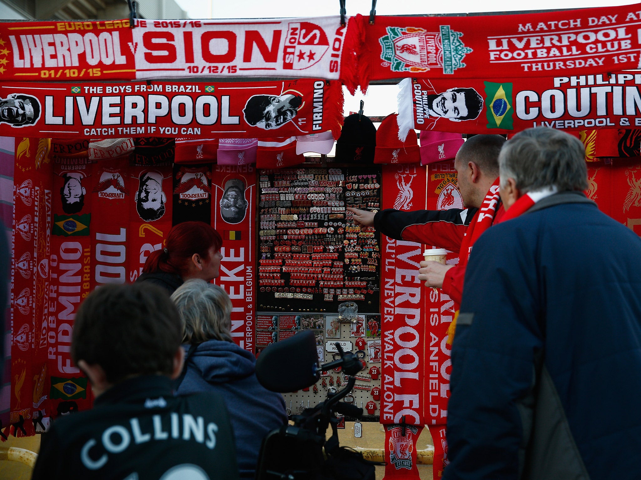 Fans peruse merchandise stalls outside Anfield ahead of tonight's Europa League clash