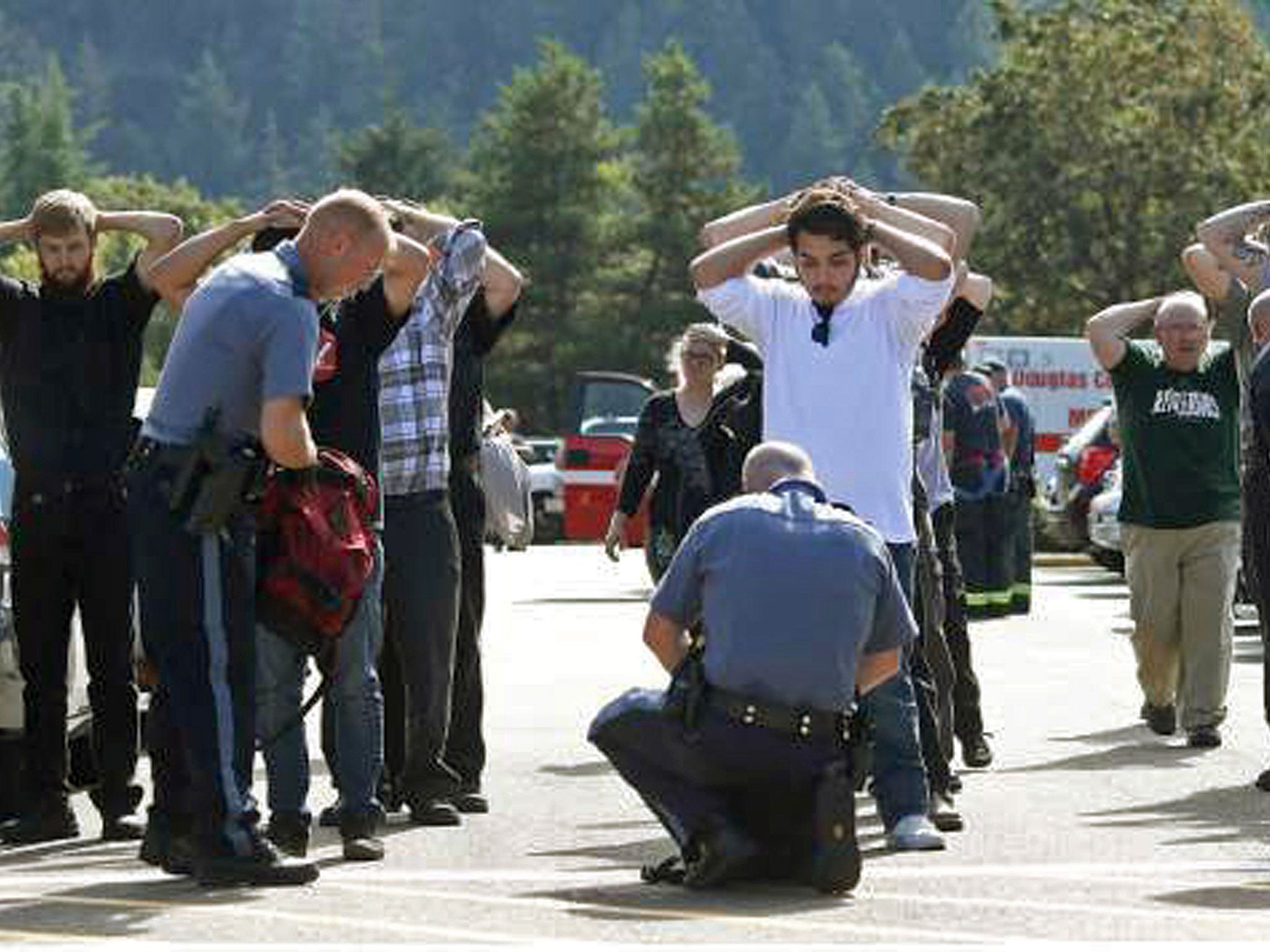 Police search students outside Umpqua Community College in Roseburg, Oregon