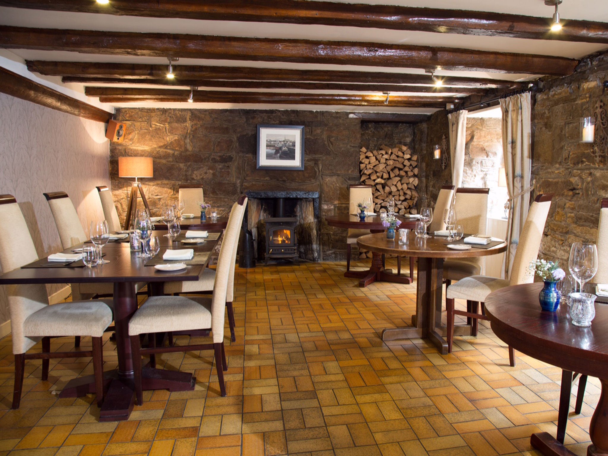 The crepuscular dining room, holding just seven tables, is as snug as a smugglers' den